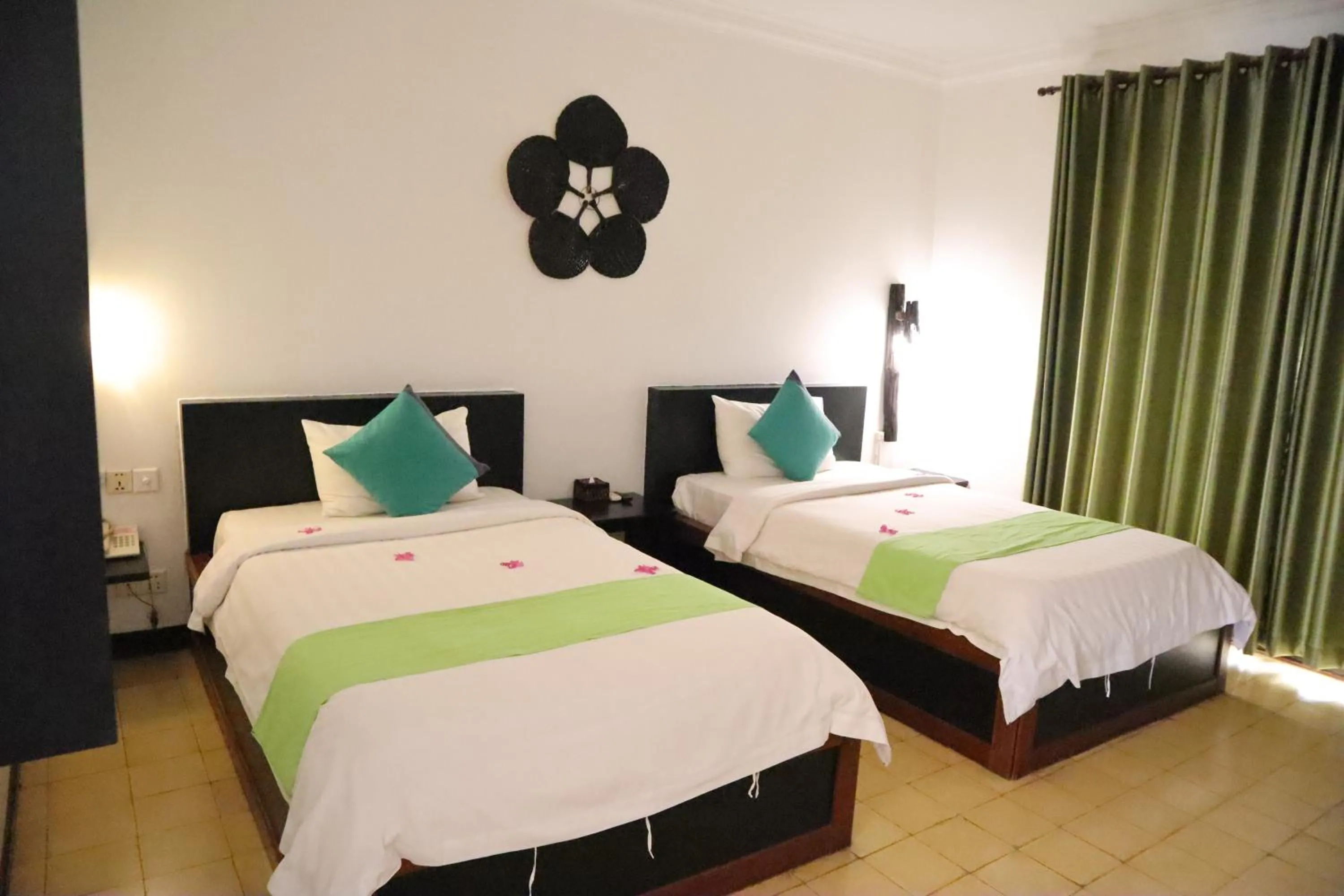 Bed in La Niche D'angkor Boutique Hotel