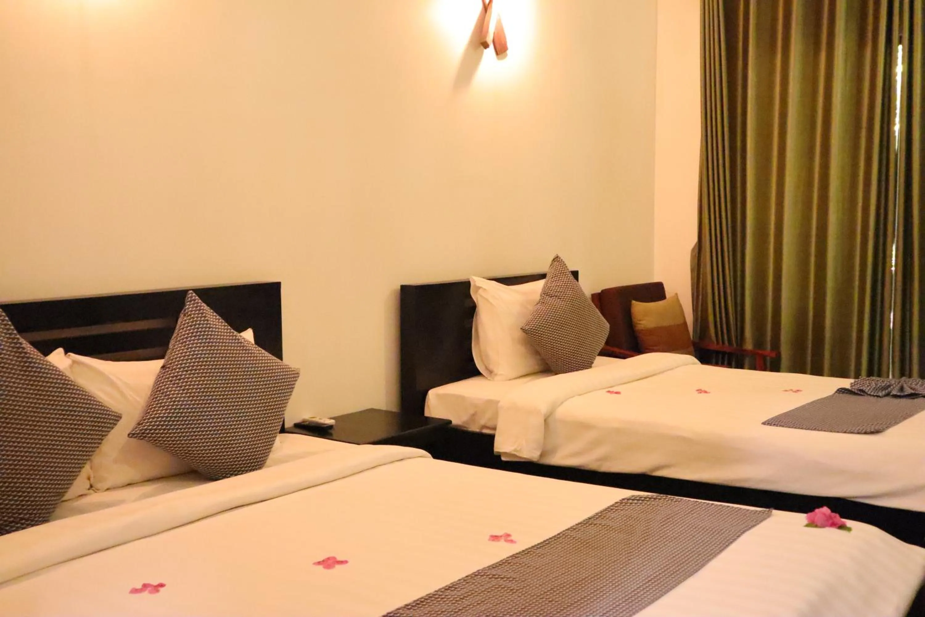 Bed in La Niche D'angkor Boutique Hotel