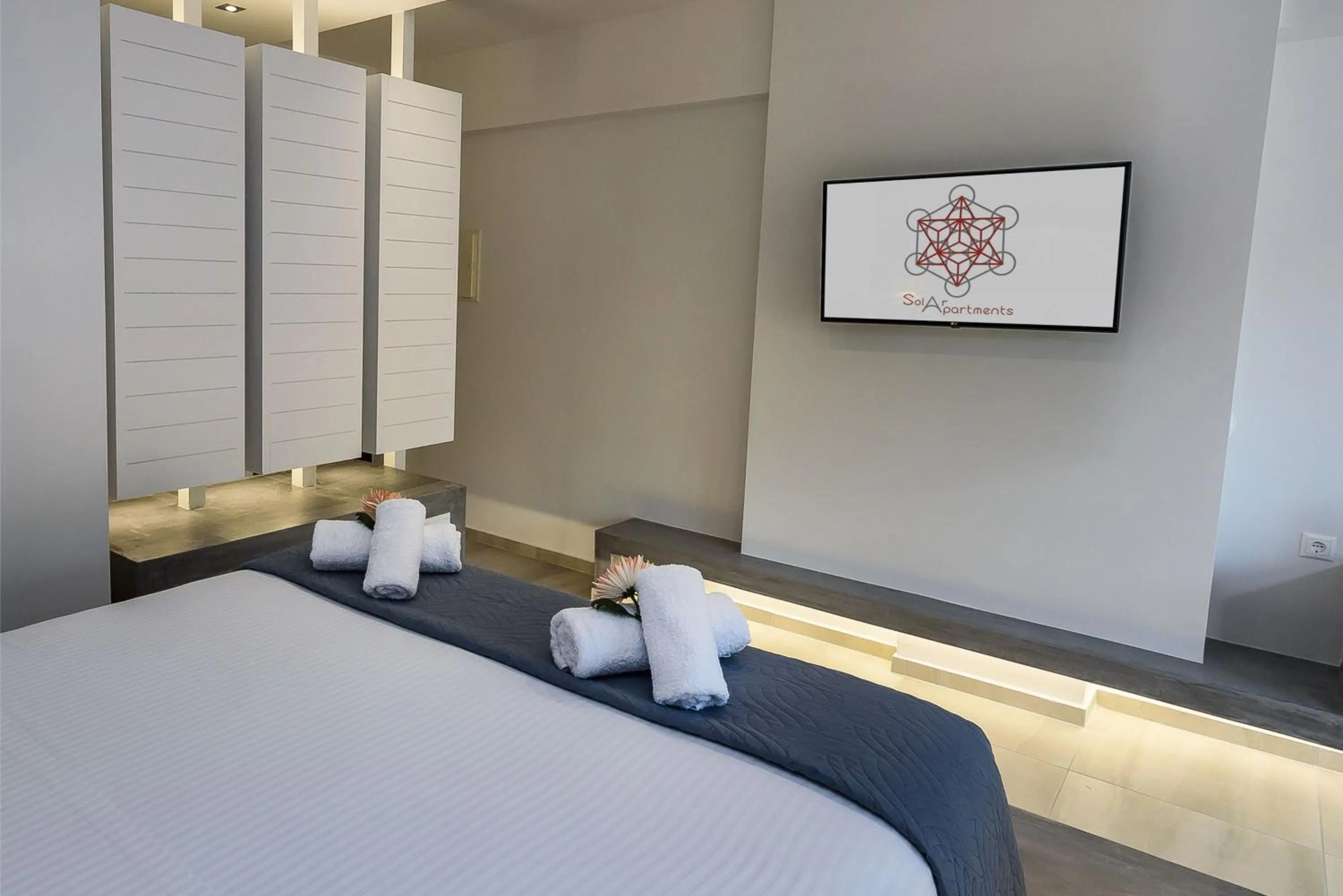 Bed in Solar Apartments by Amara Living