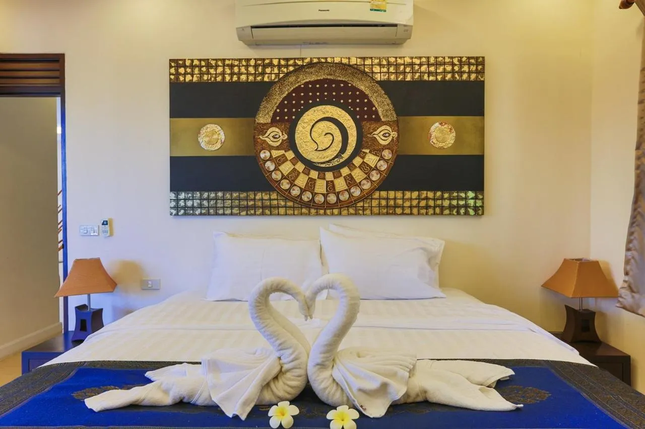 Bed in Pa Prai Villas and Suites Resort