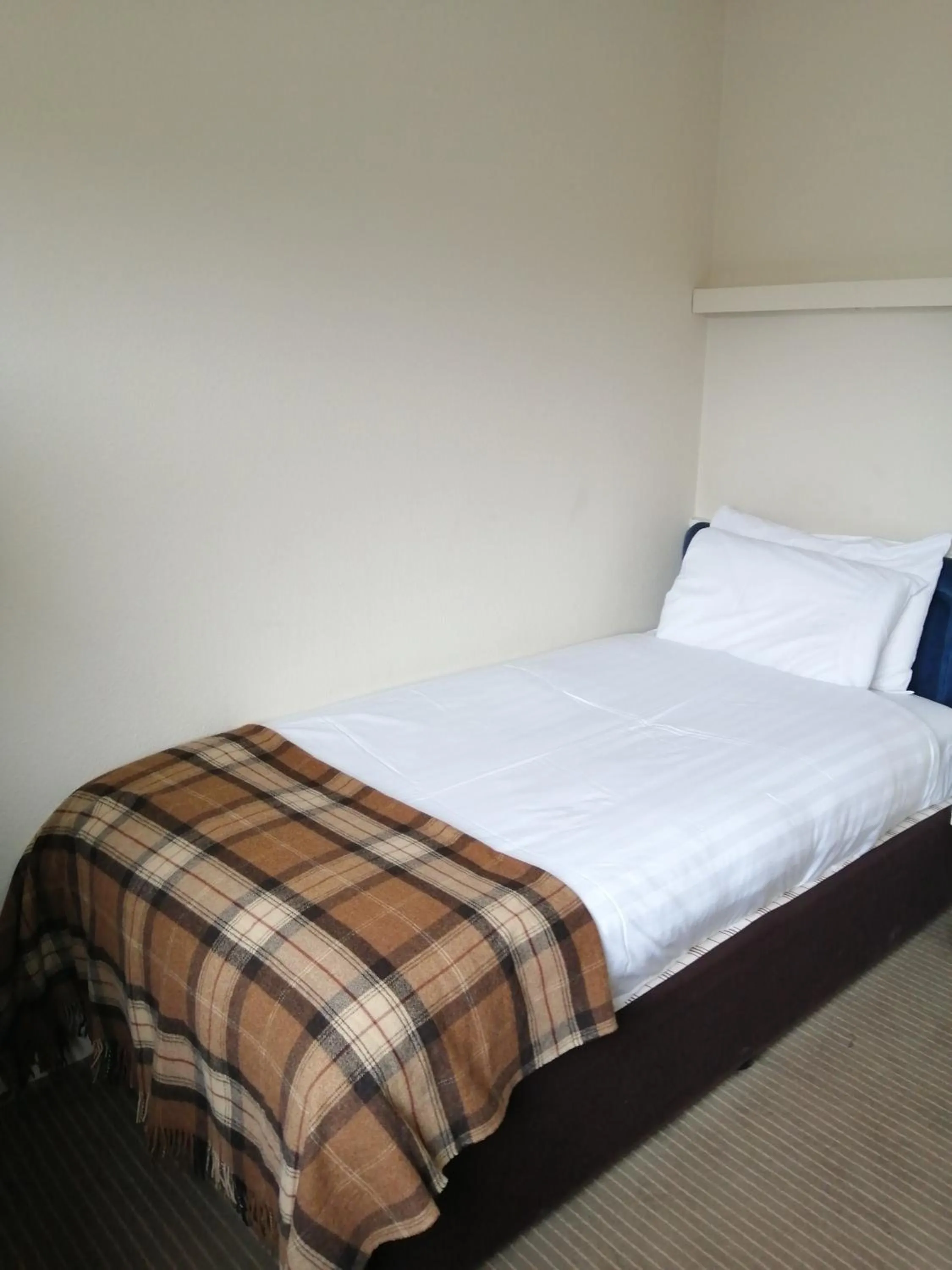 Bed in Eight Acres Hotel