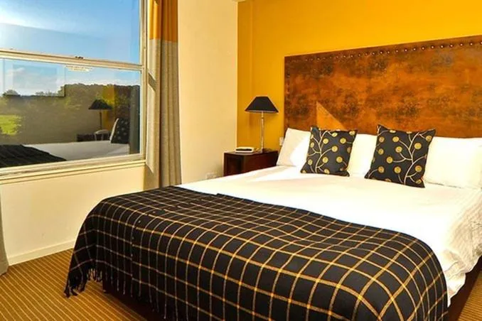 Bedroom in Eight Acres Hotel