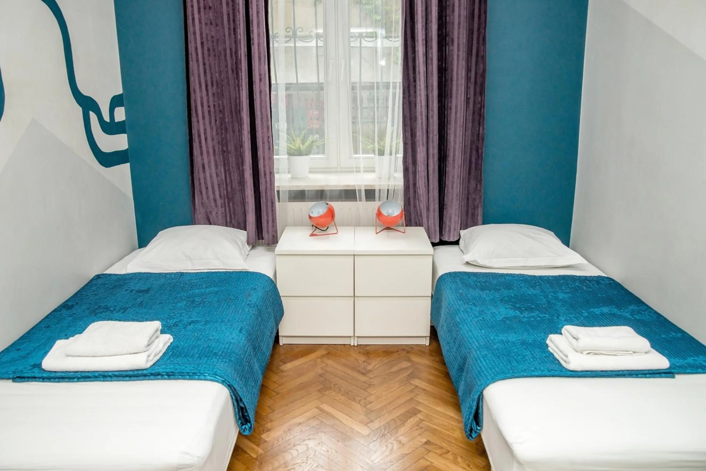 Bed in Red Kurka Apartments