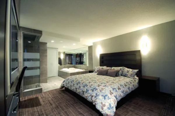 Bed in Le Fabreville Motel & Suites