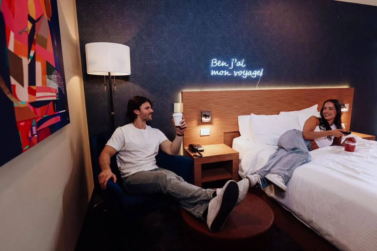 Bed in Le Fabreville Motel & Suites