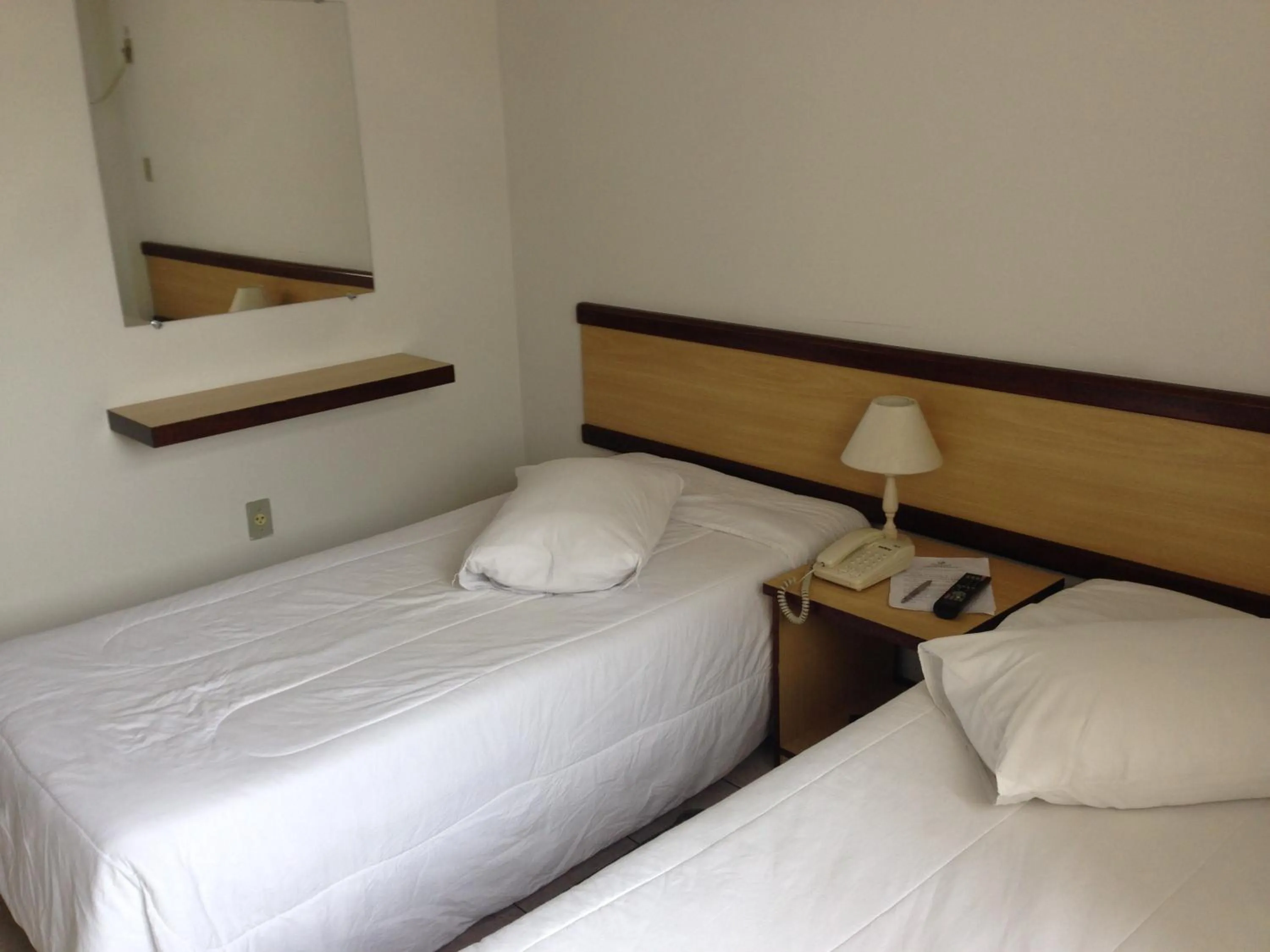 Bed in Solar Flat Hotel