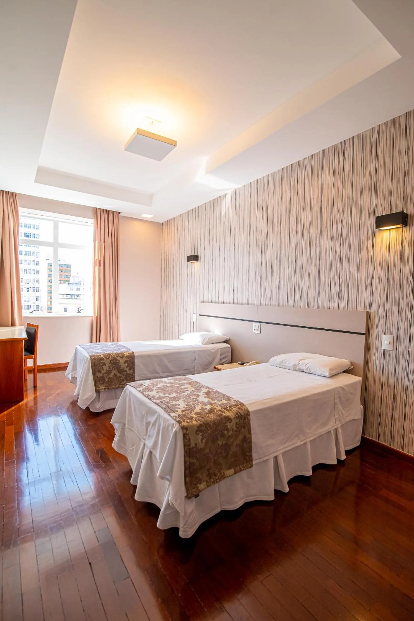 Bed in Serrano Residencial Hotel