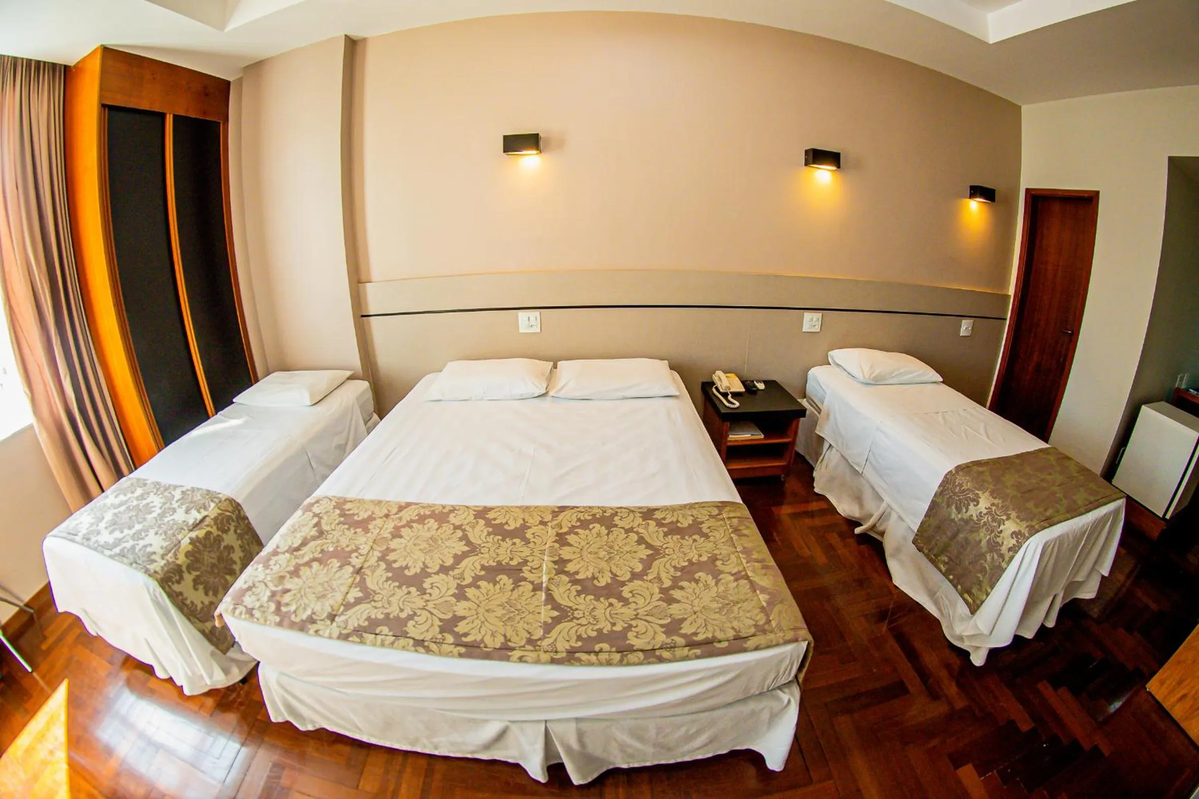 Quadruple Room (1 Double bed + 2 Single beds) in Serrano Residencial Hotel