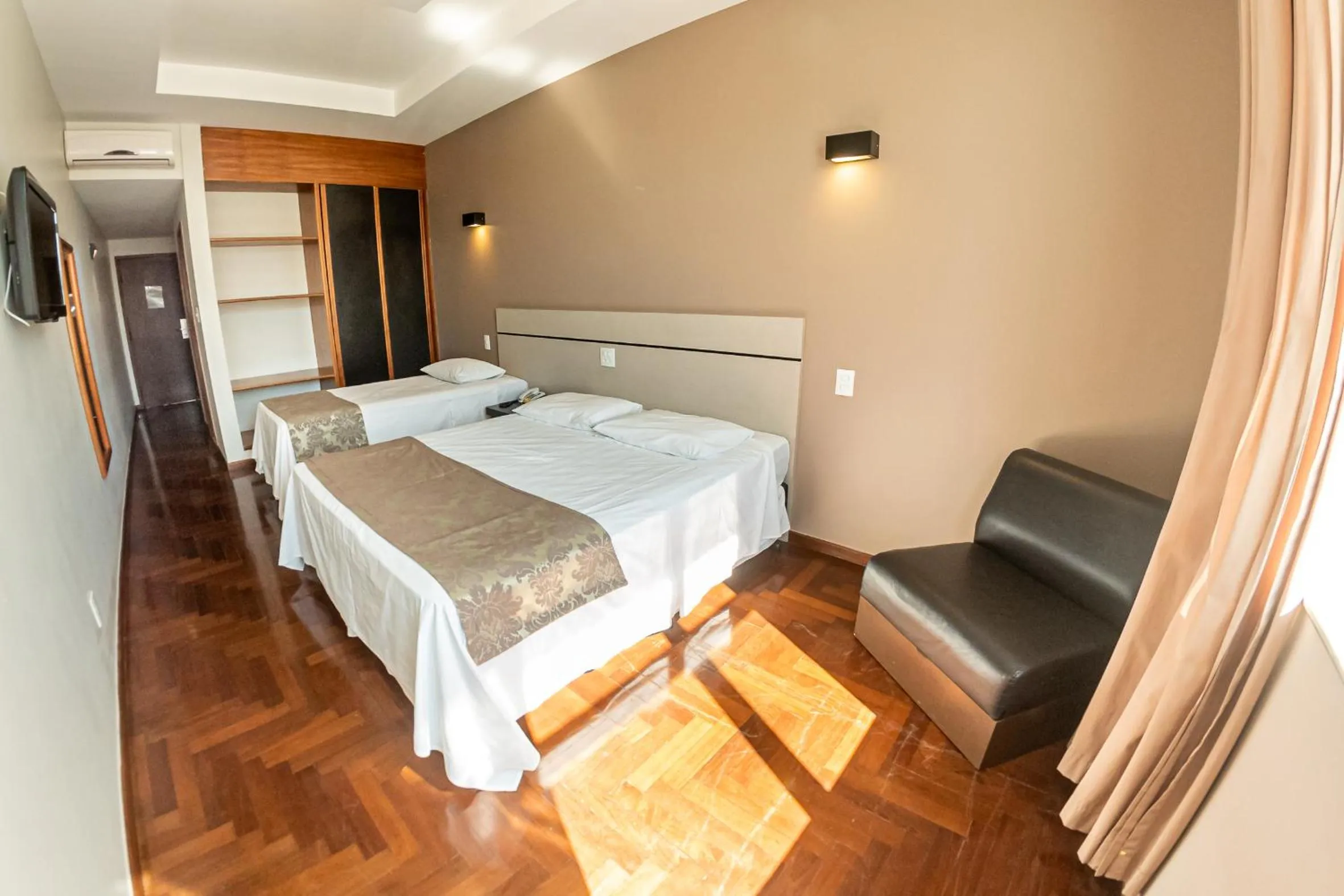 Bed in Serrano Residencial Hotel