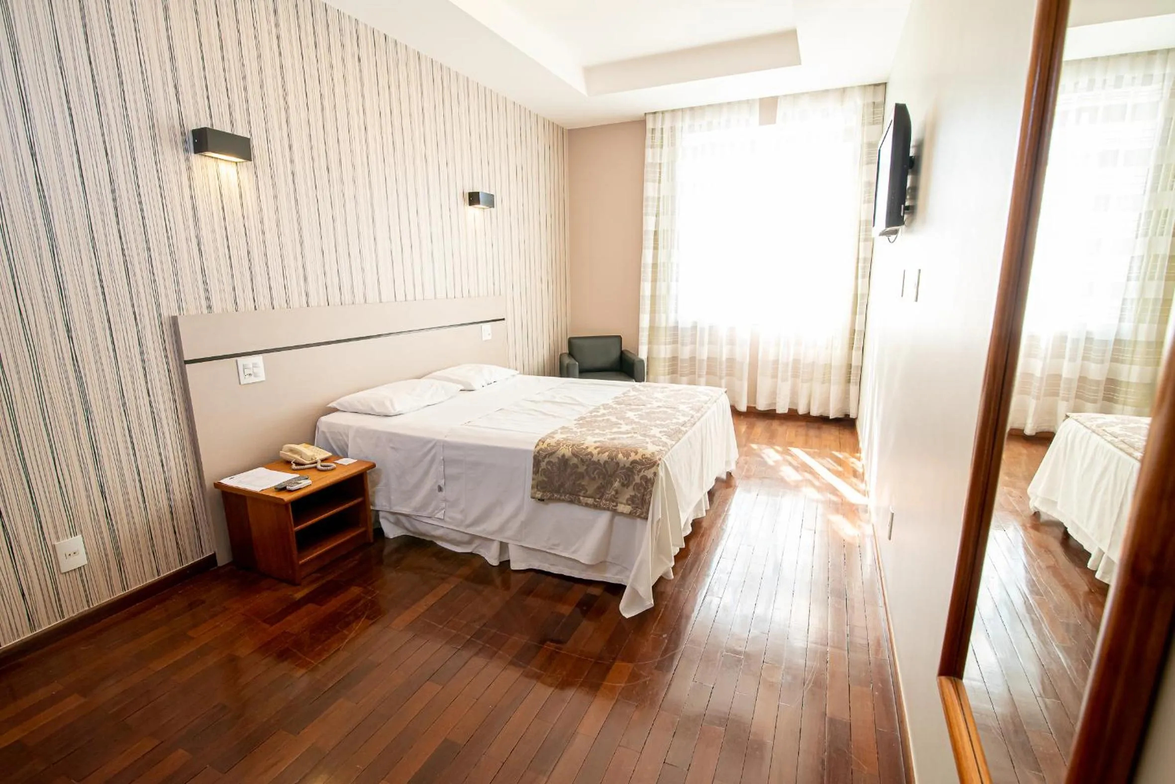 Bed in Serrano Residencial Hotel