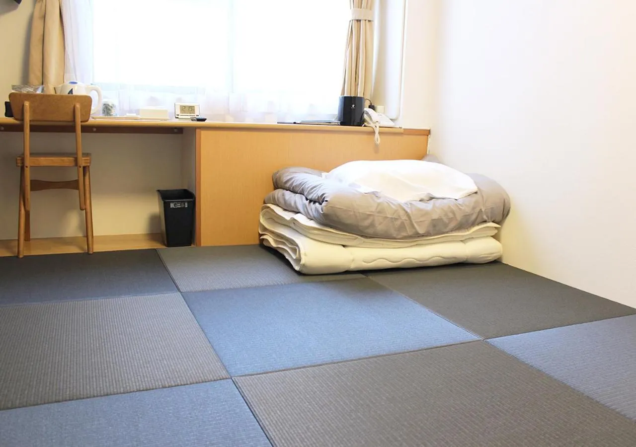 Photo of the whole room, Bed in Hotel Sun Garden Matsuyama