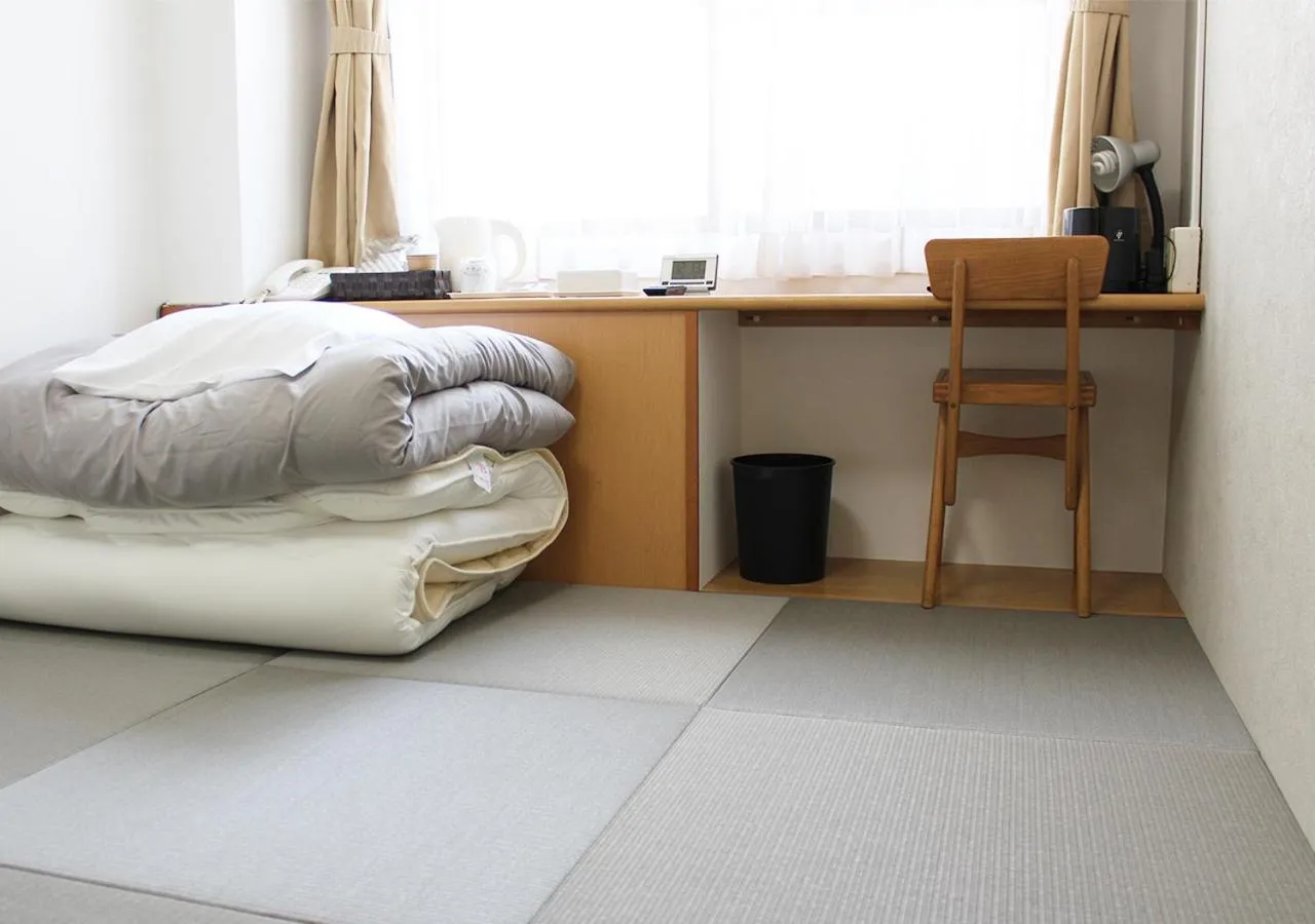 Photo of the whole room, Bed in Hotel Sun Garden Matsuyama