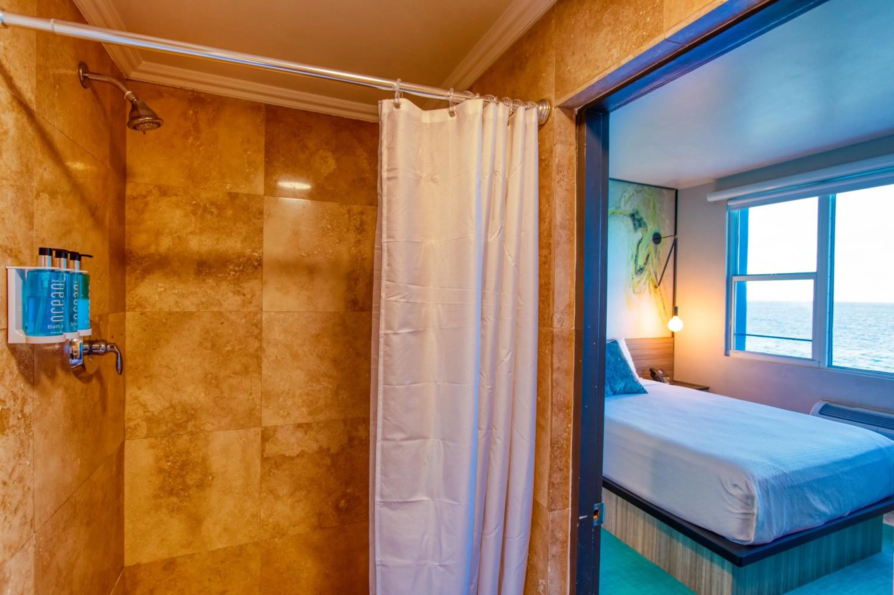 Bathroom, Bed in The Tryst Beachfront Hotel
