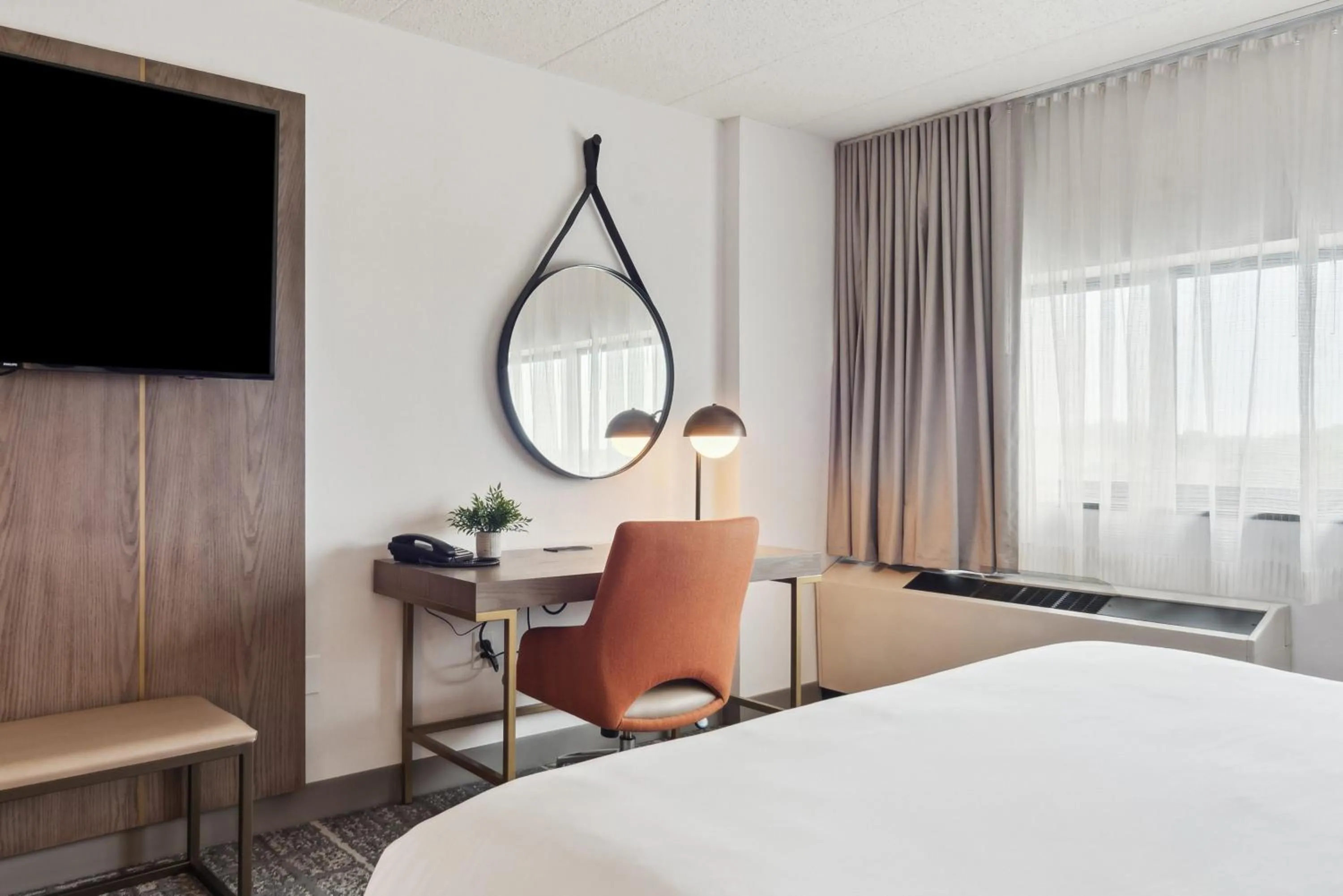 Photo of the whole room, Bed in Crowne Plaza Lansing by IHG