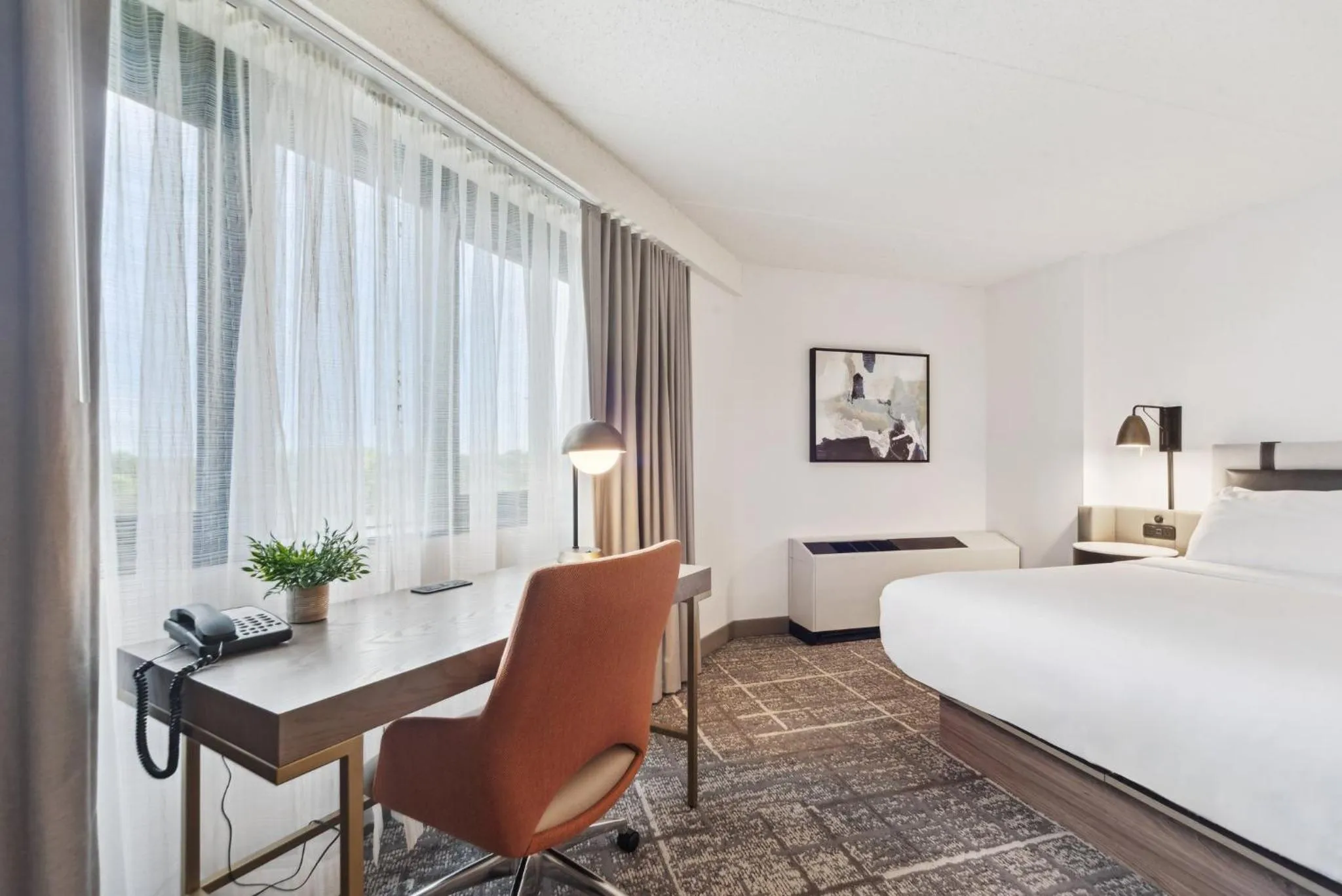 Photo of the whole room, Bed in Crowne Plaza Lansing by IHG