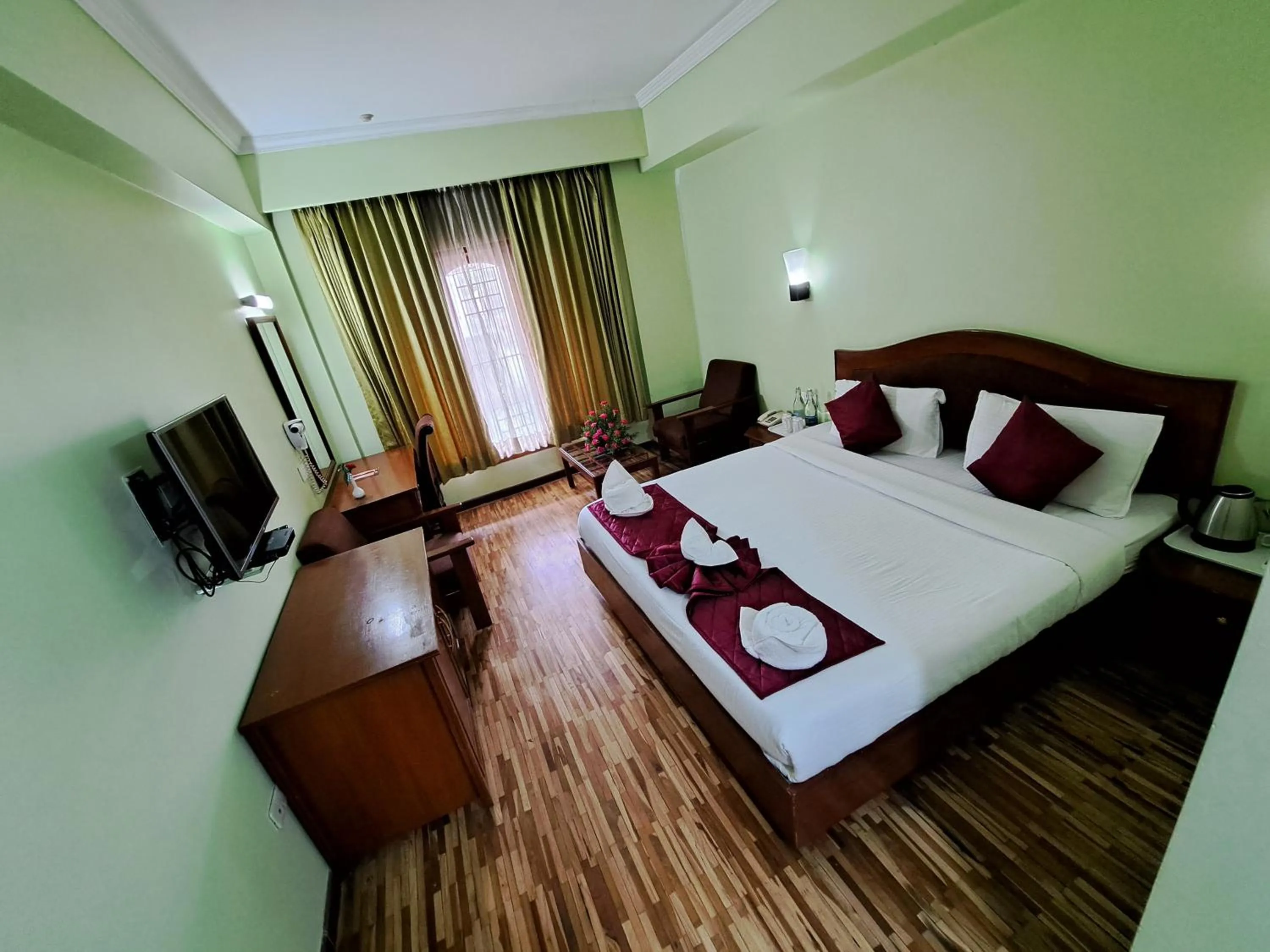 Bed in Hotel Preethi Classic Towers