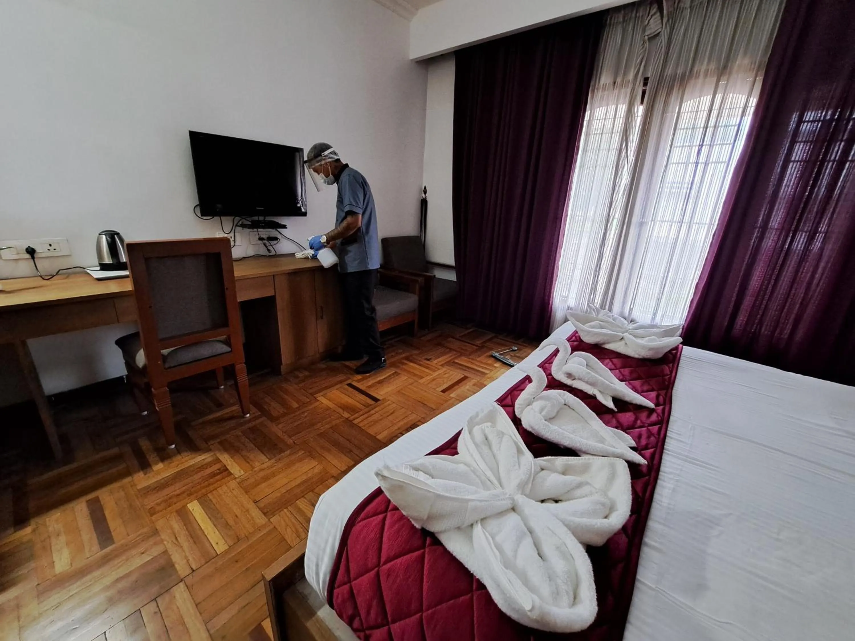 Bed in Hotel Preethi Classic Towers