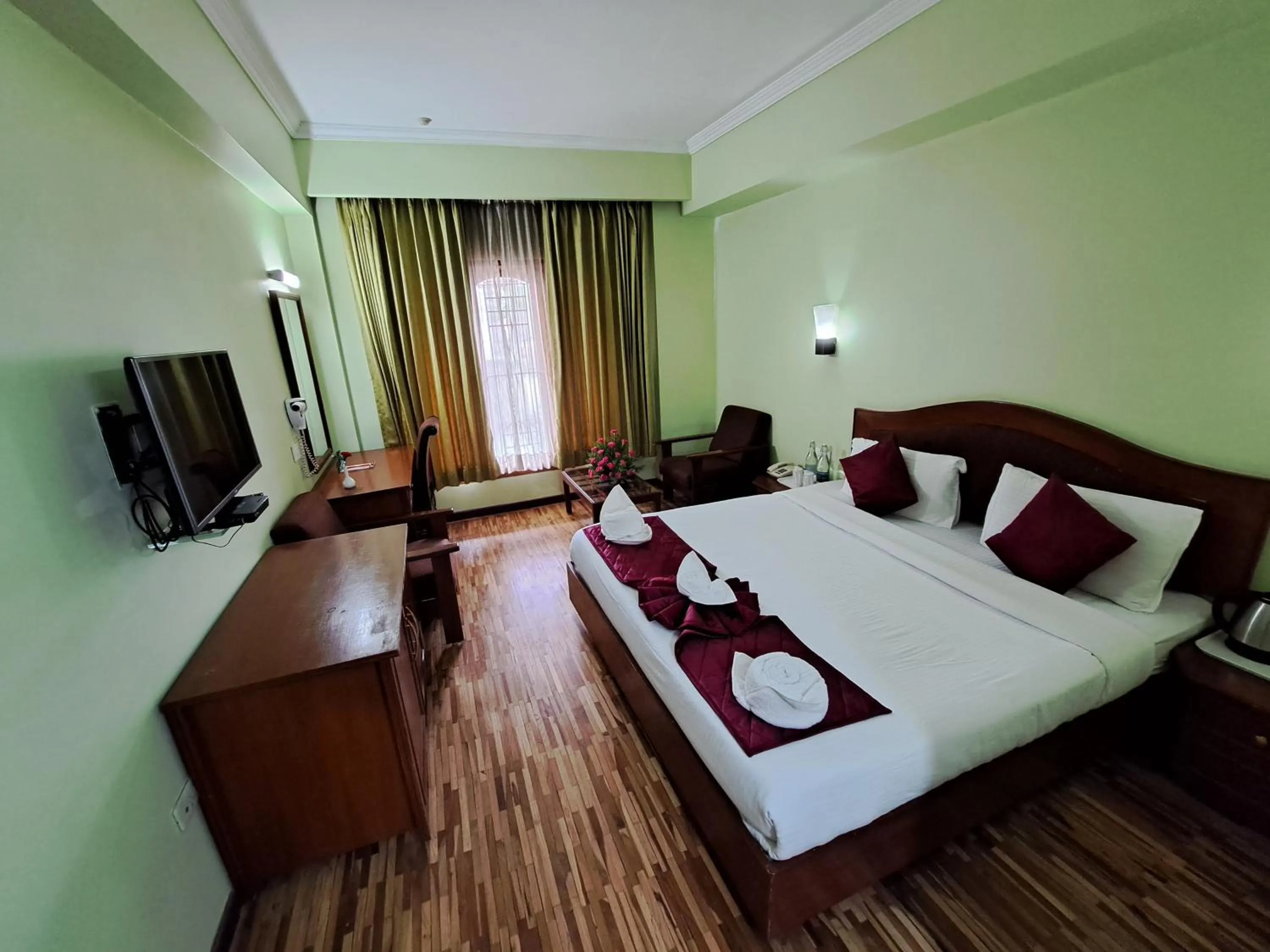 Bed in Hotel Preethi Classic Towers