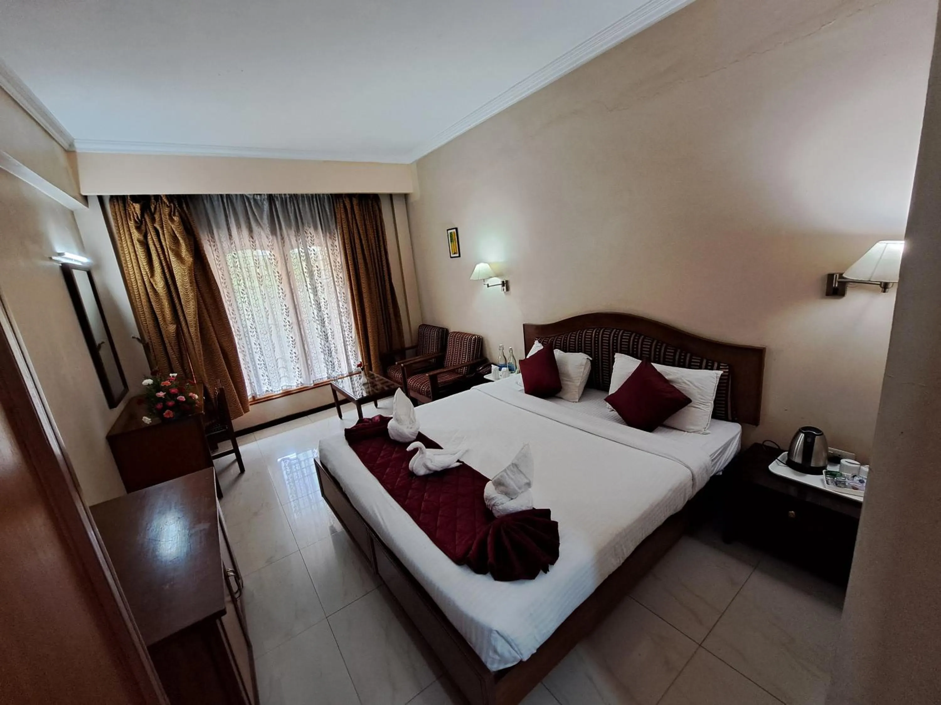 Bed in Hotel Preethi Classic Towers