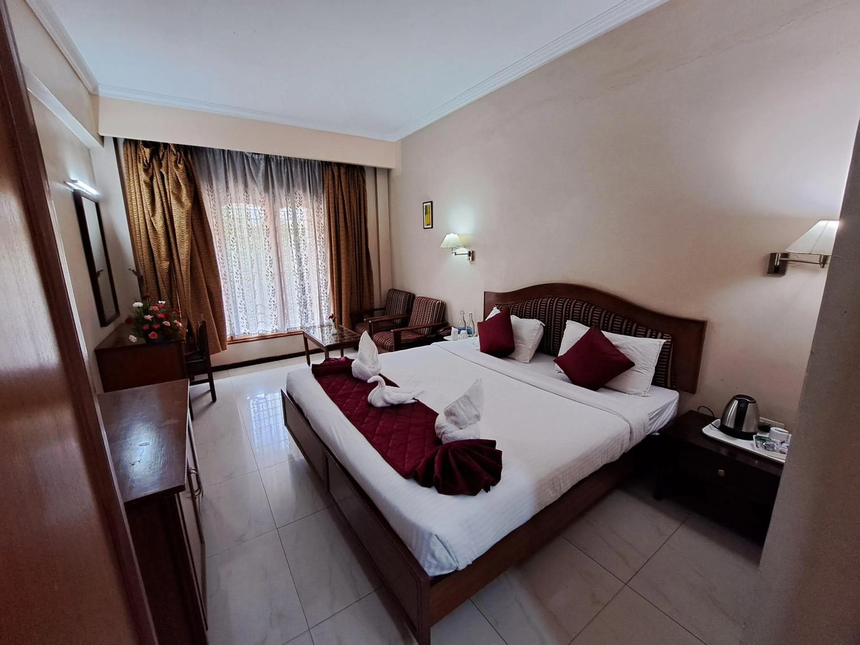 Bed in Hotel Preethi Classic Towers