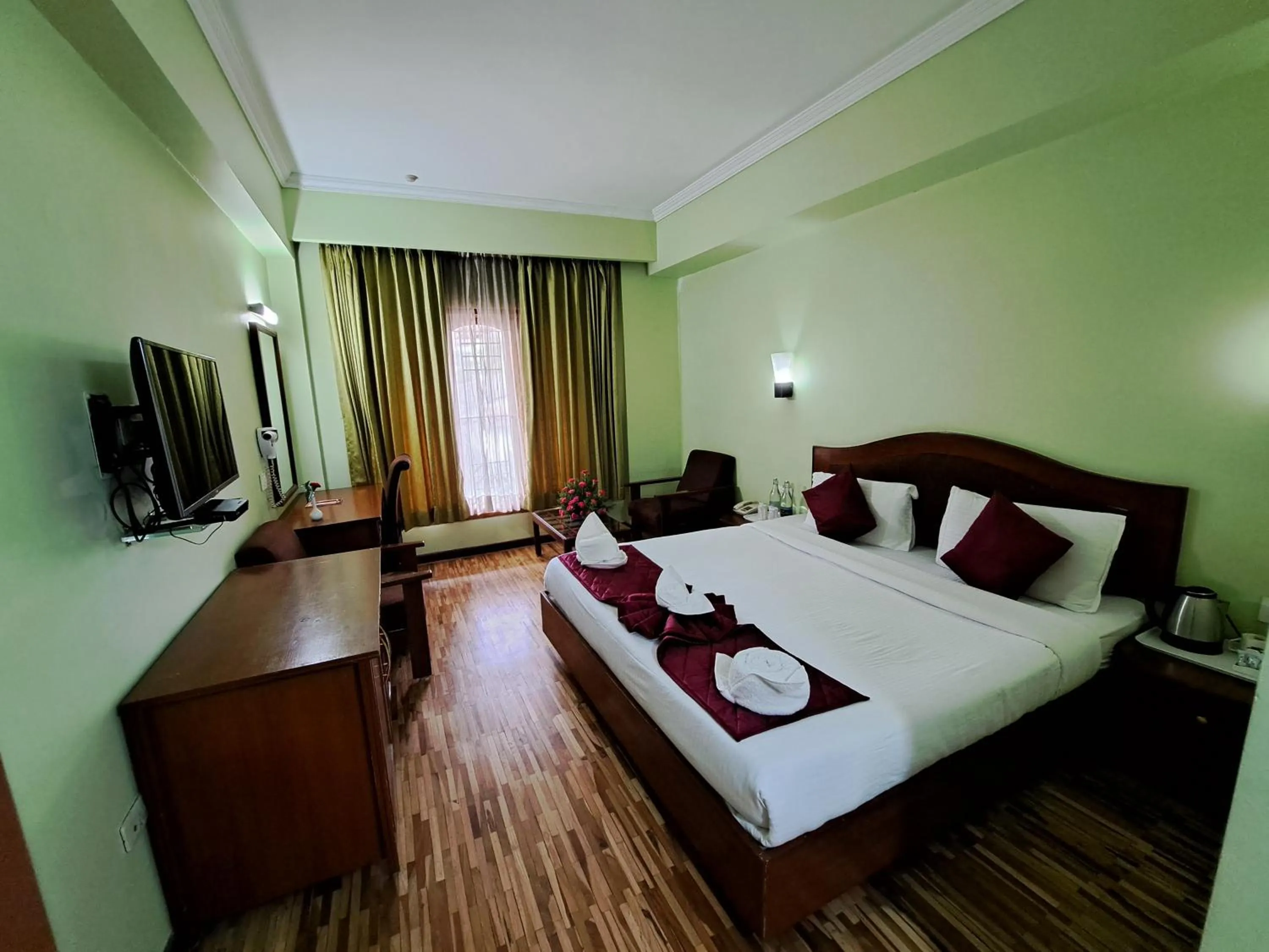 Bed in Hotel Preethi Classic Towers