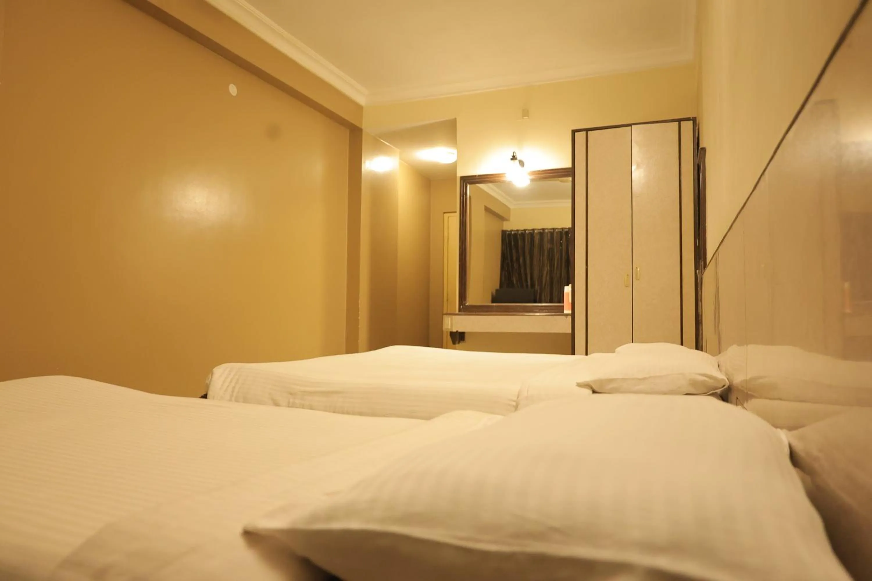 Bed in Hotel Mangalore International