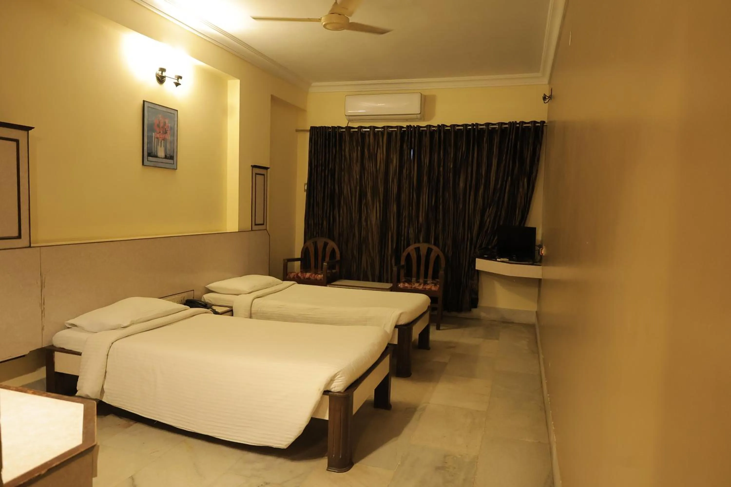 Bed in Hotel Mangalore International