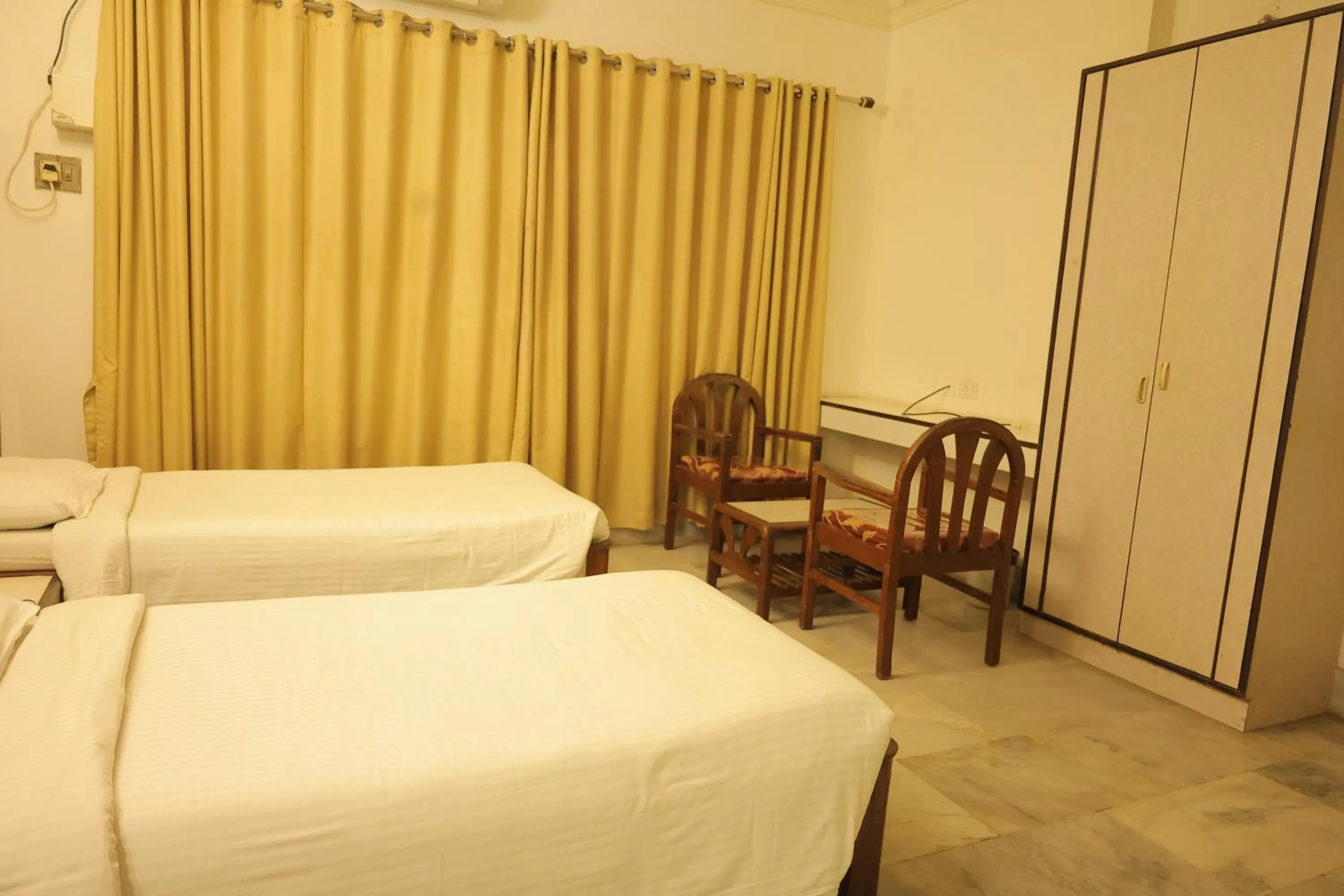 Bed in Hotel Mangalore International