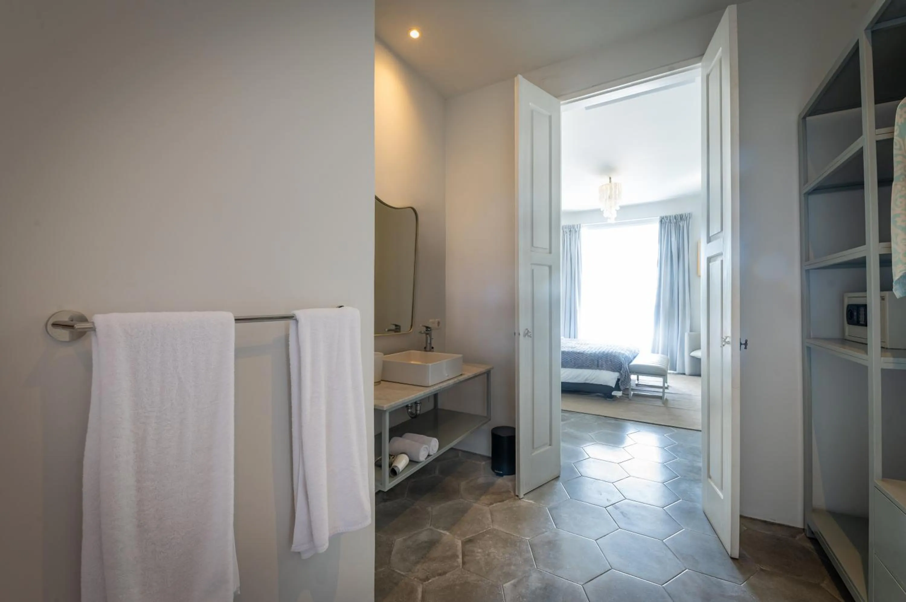 Bathroom, Bed in Lusa Beach Studios Under New Management And Newly Renovated