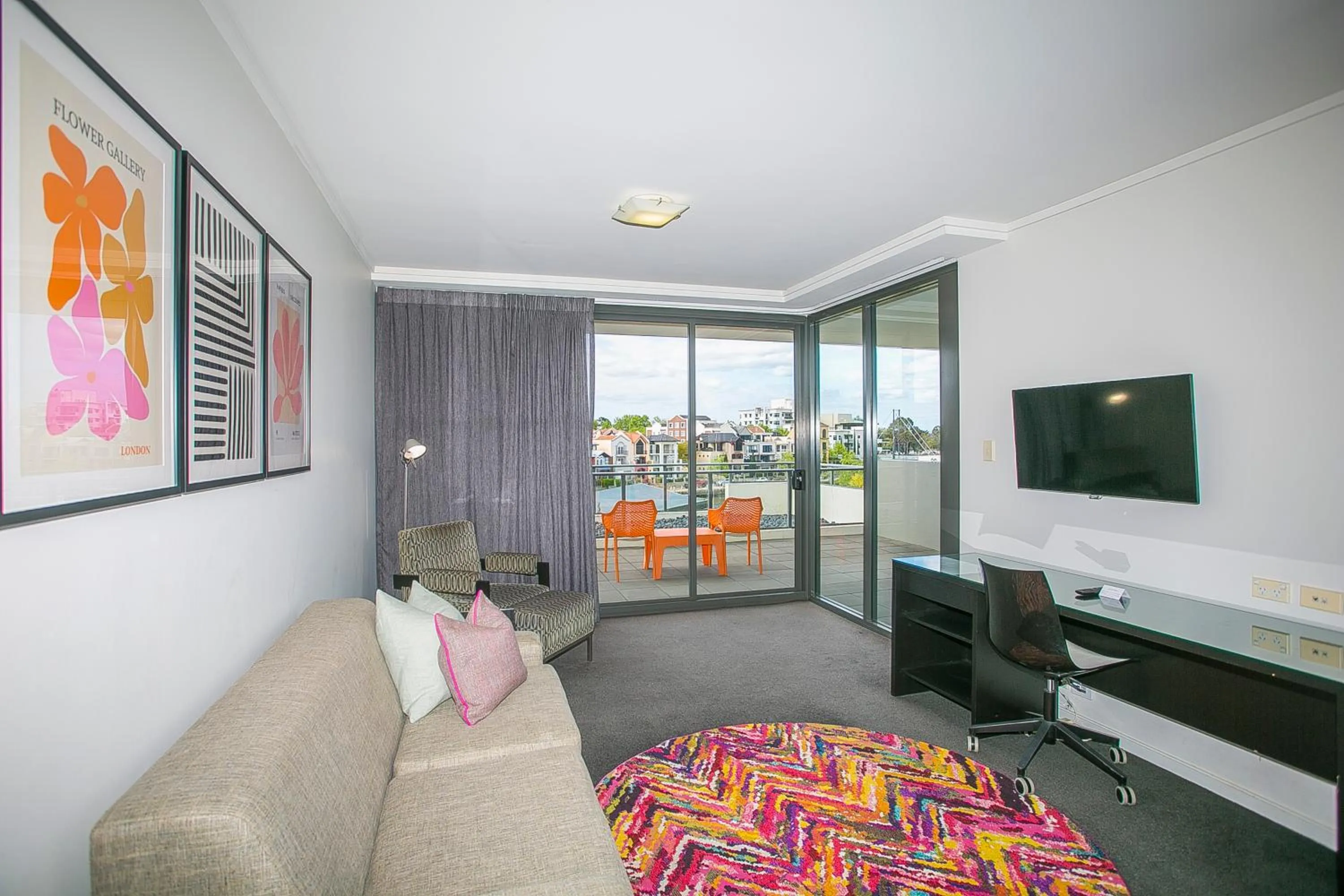 Communal lounge/ TV room, Bed in East Perth Suites Hotel
