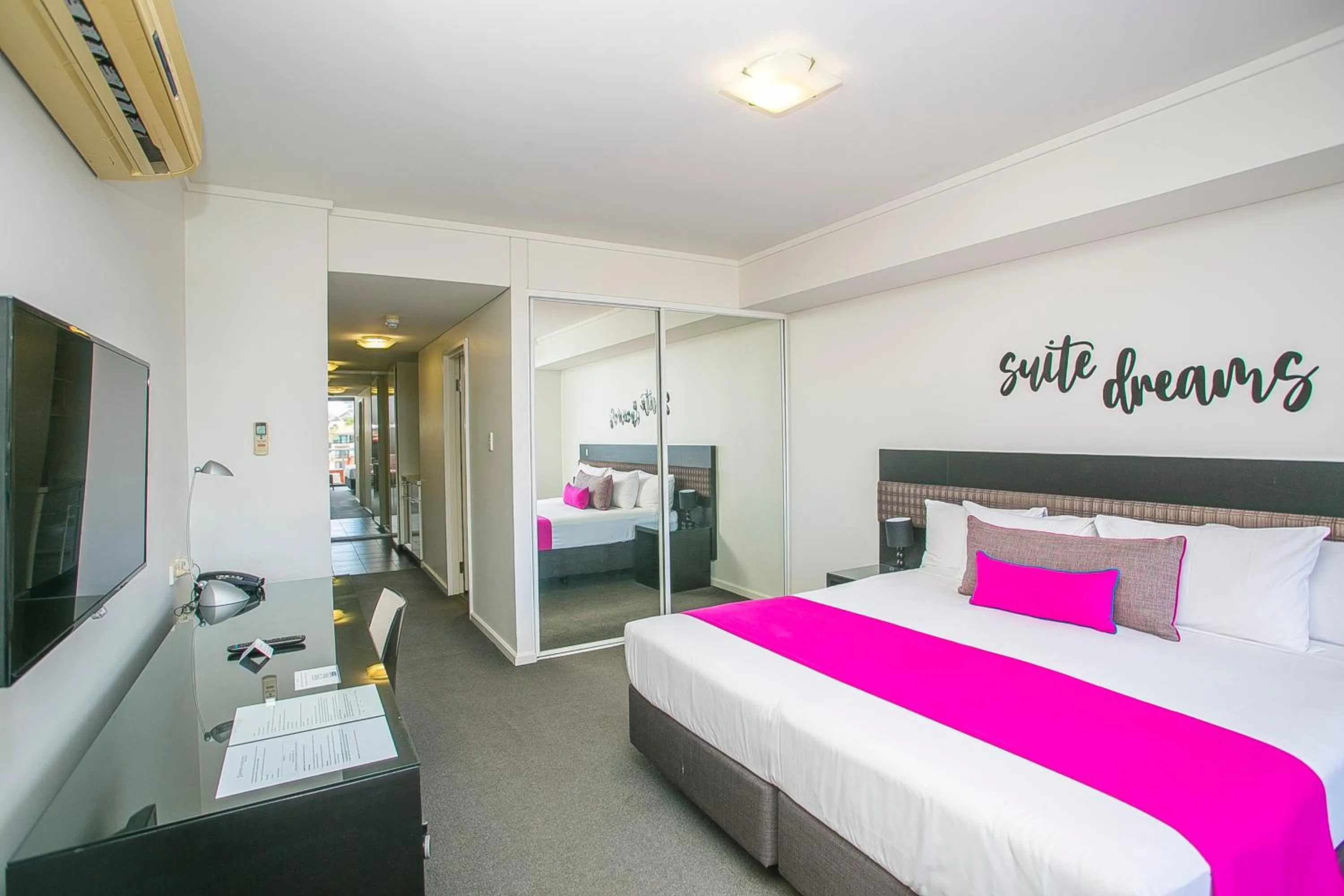 Bed in East Perth Suites Hotel