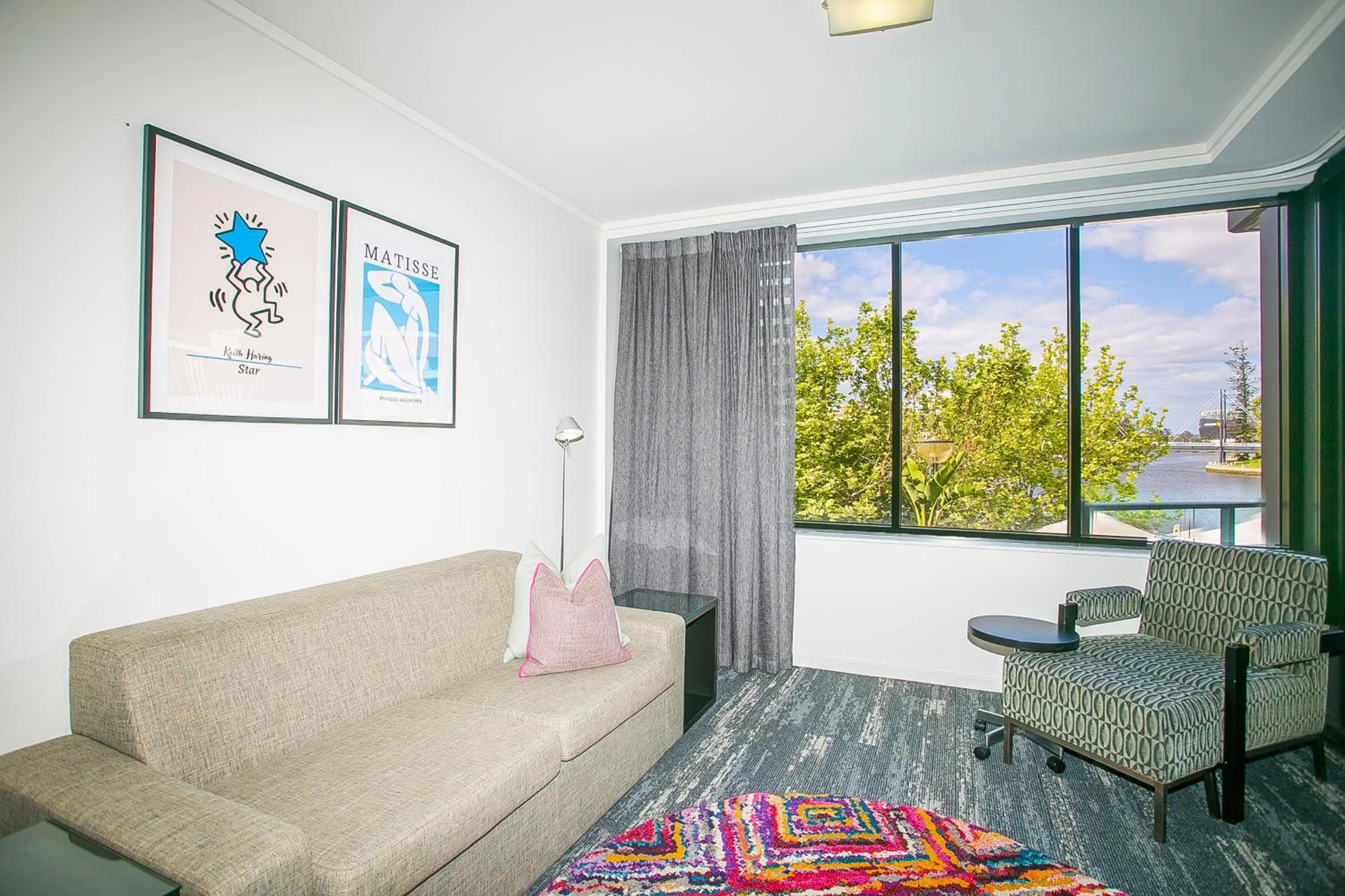 Communal lounge/ TV room in East Perth Suites Hotel