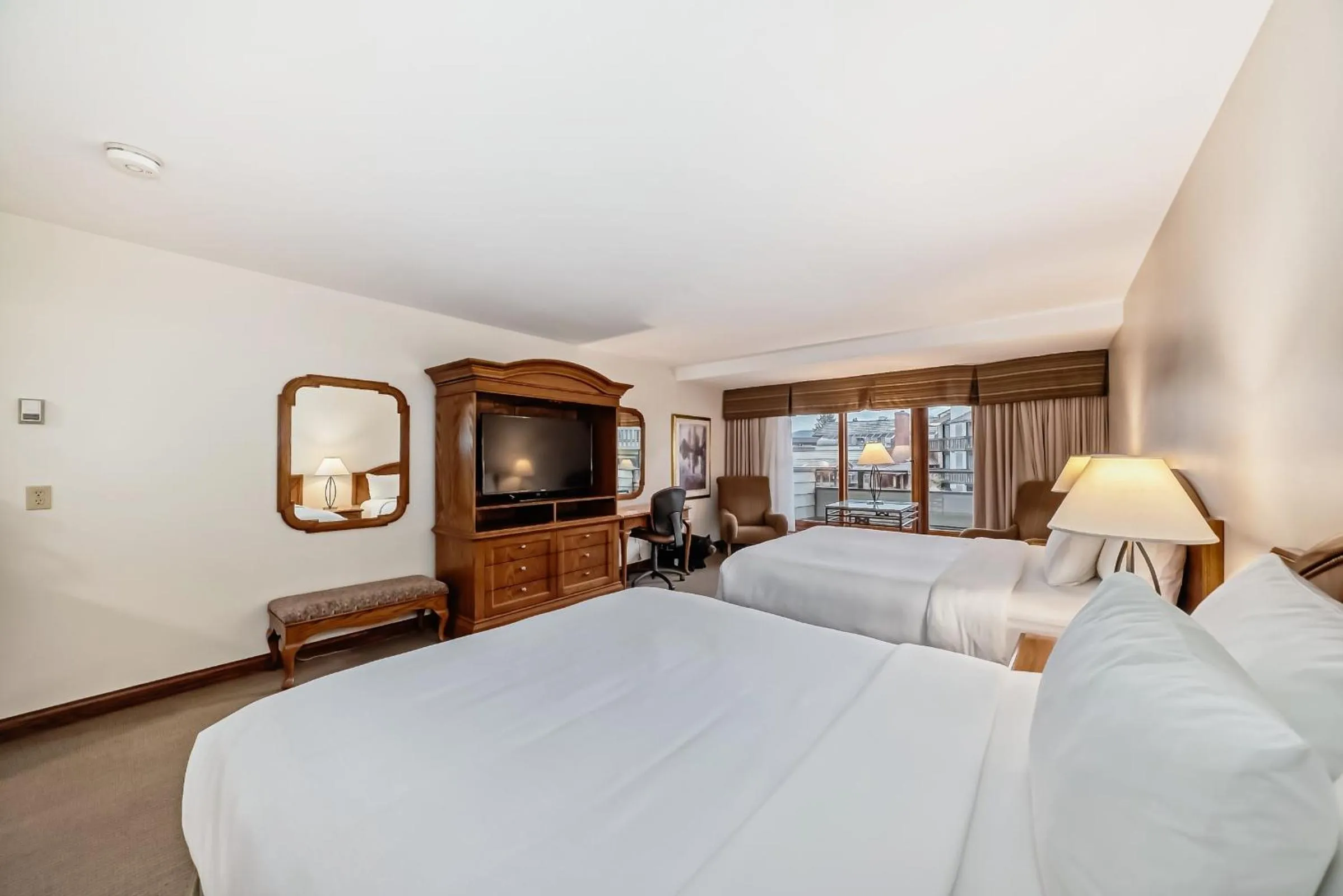 Bed in Jasper Inn & Suites by INNhotels