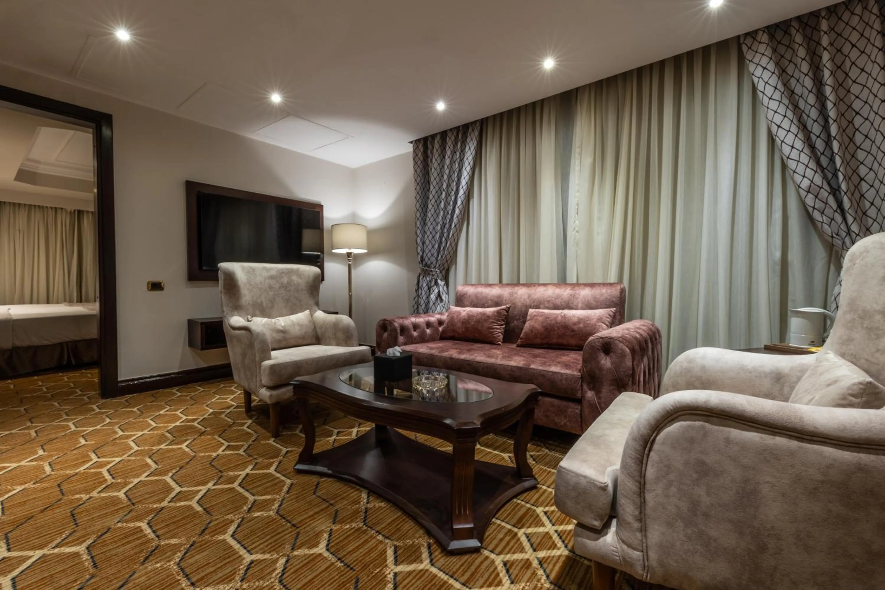 Living room in Triumph Plaza Hotel