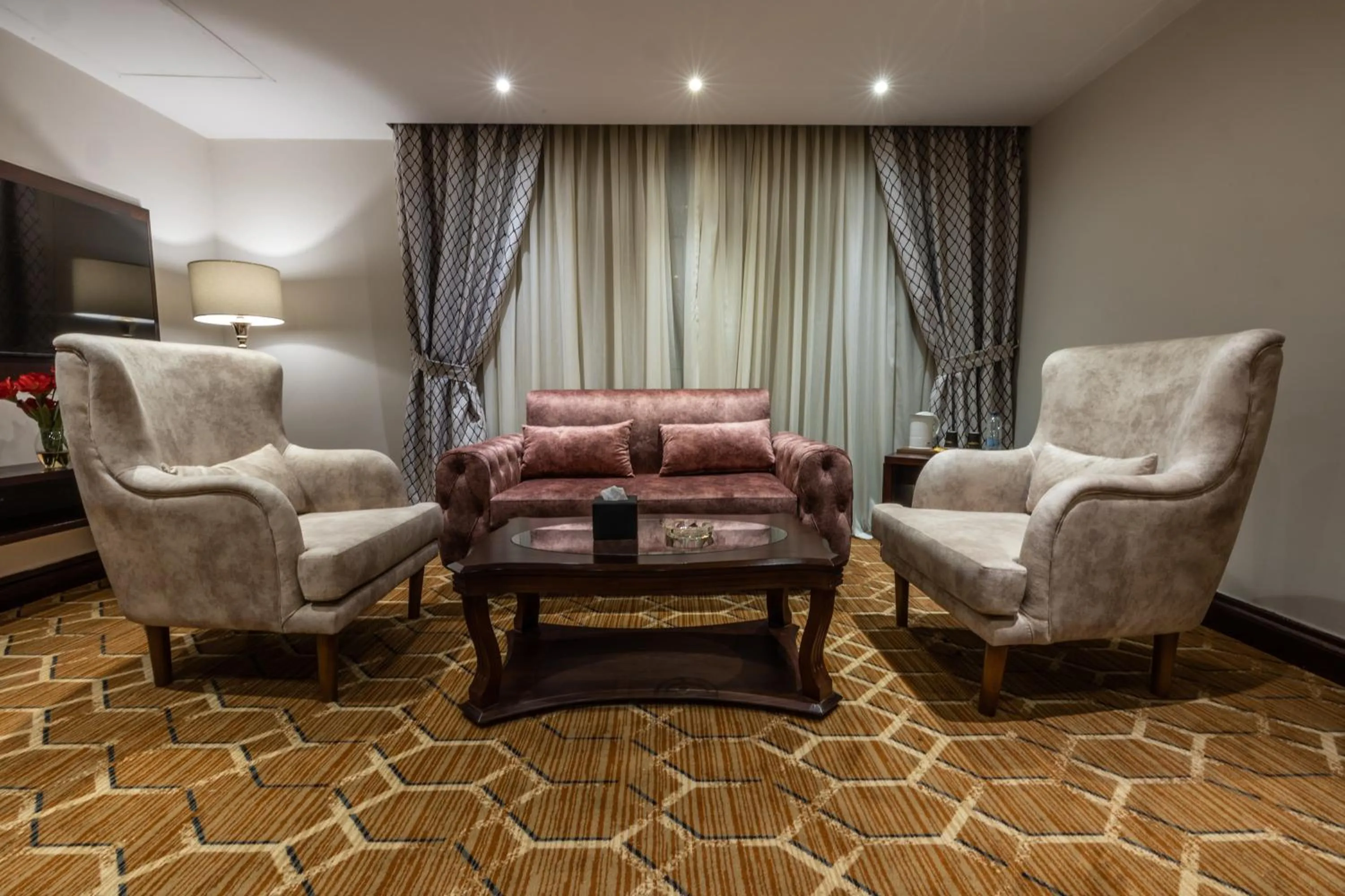 Living room in Triumph Plaza Hotel