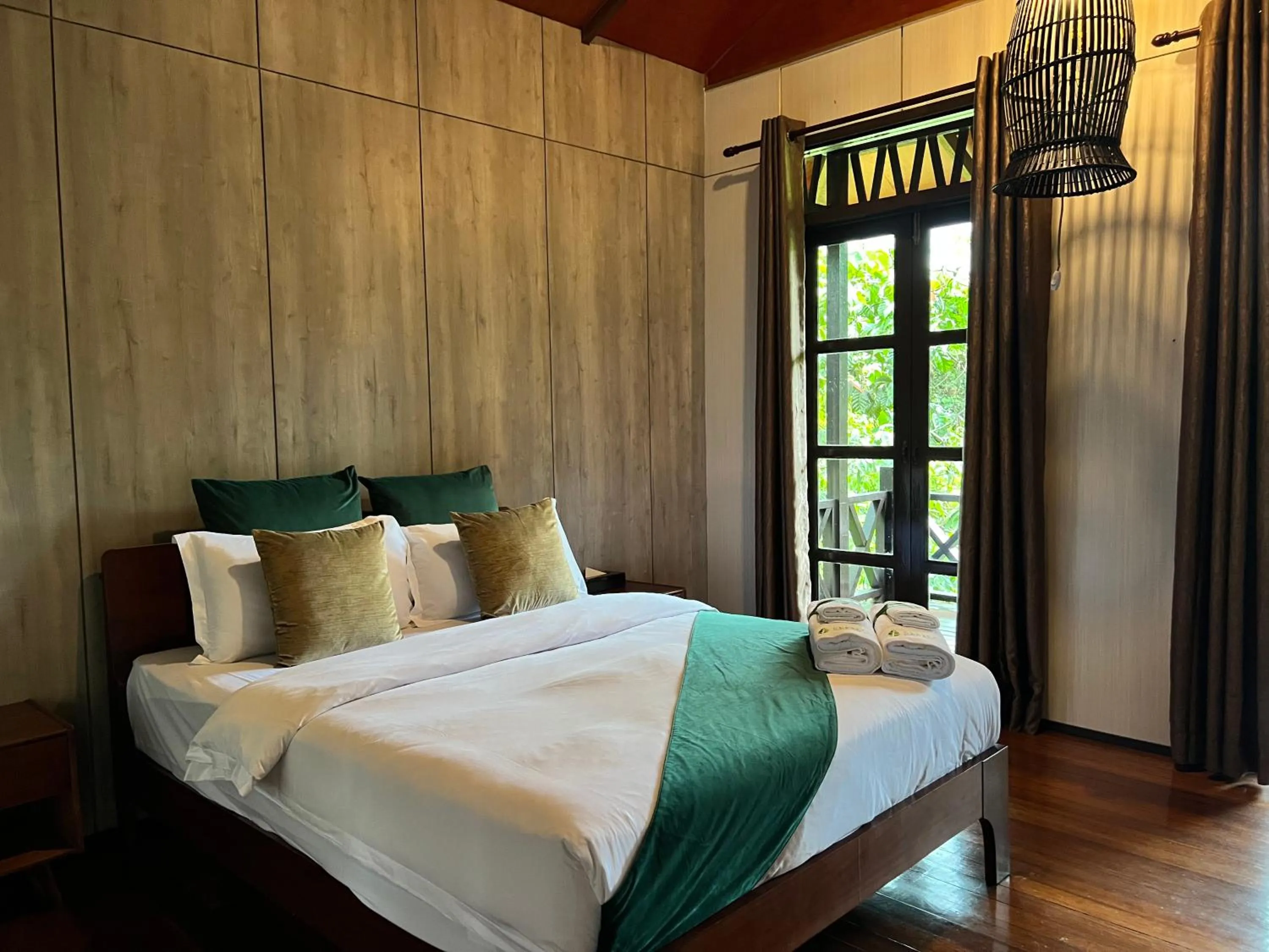 Bed in Sepilok Forest Edge Resort