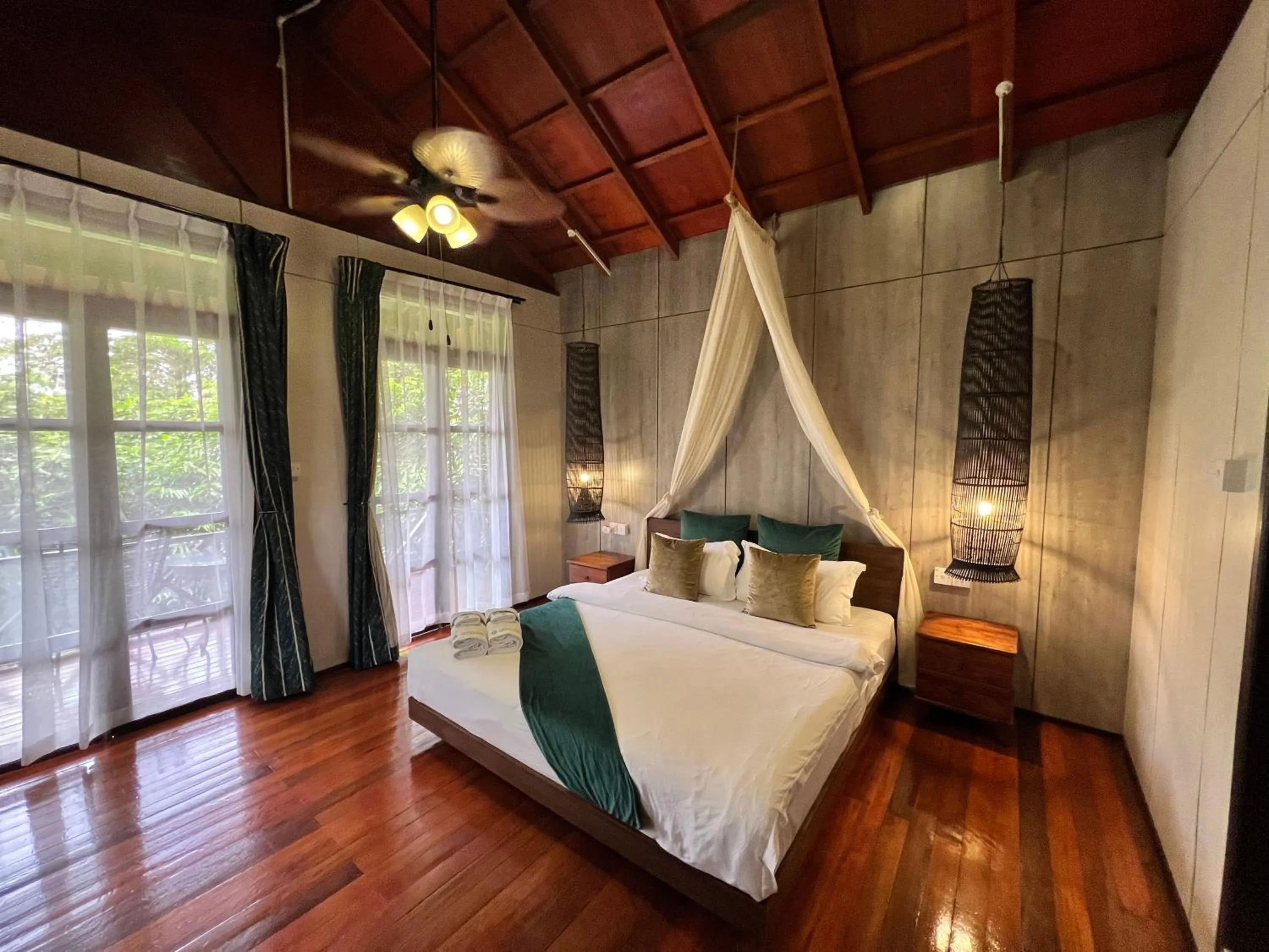 Bed in Sepilok Forest Edge Resort