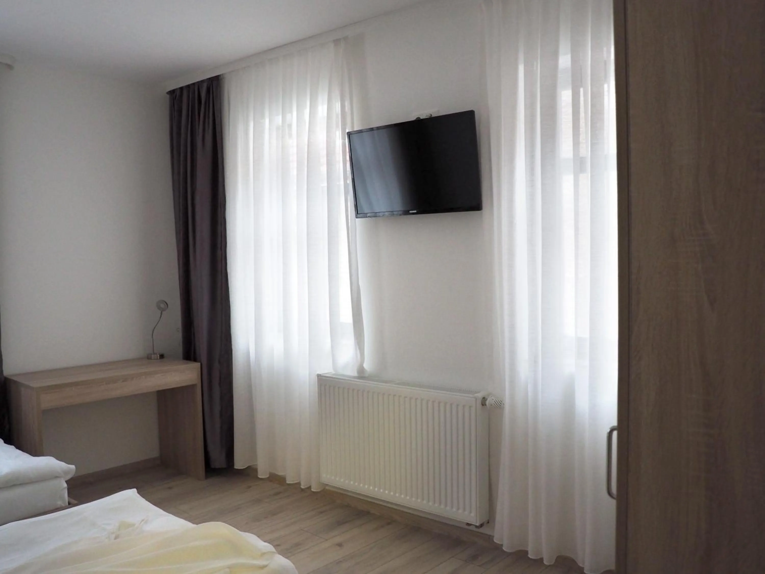 Bed in Pension Villa Colosseo im Herzen von Meiningen