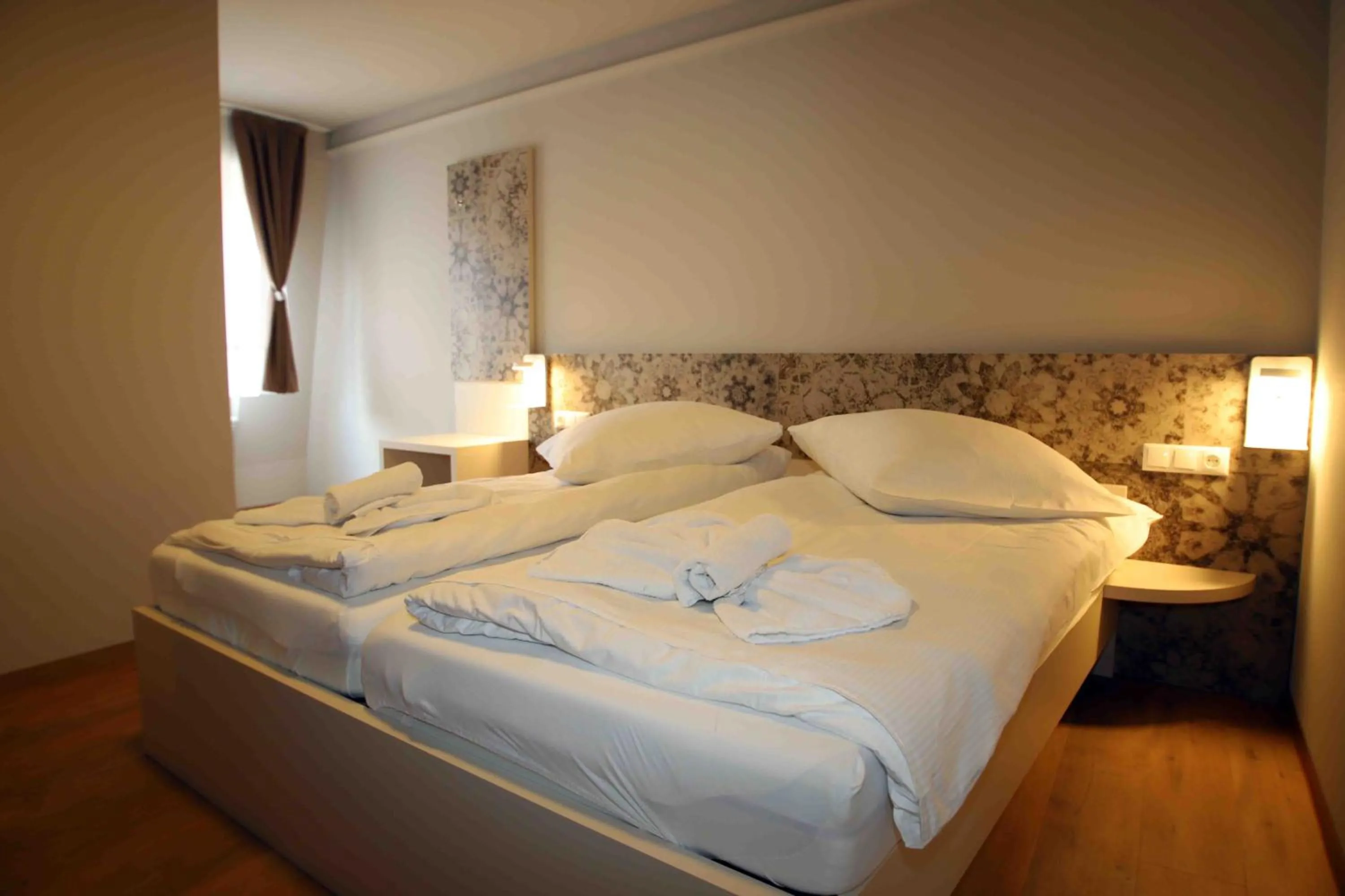 Bed in Pension Villa Colosseo im Herzen von Meiningen