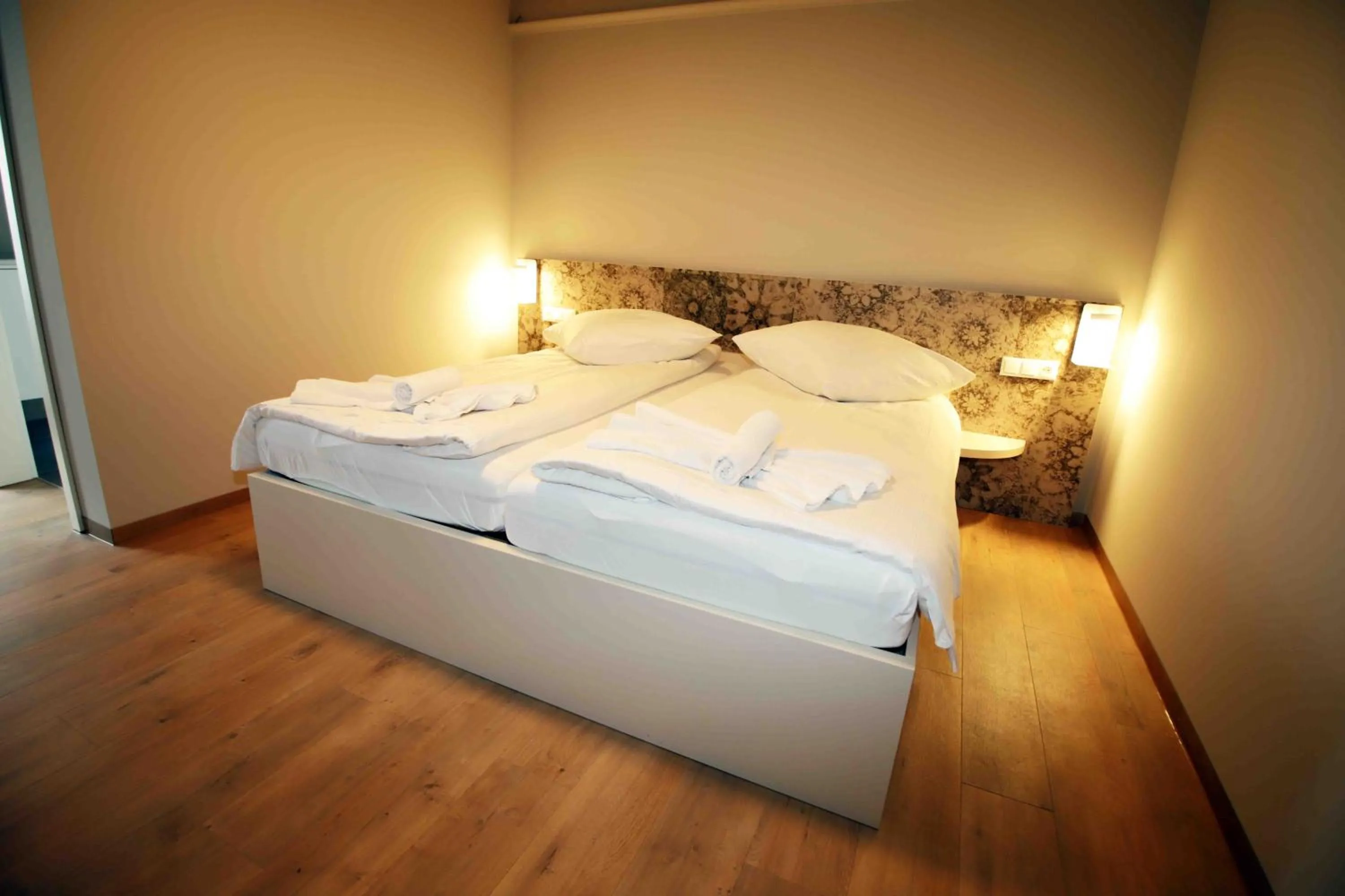 Bed in Pension Villa Colosseo im Herzen von Meiningen