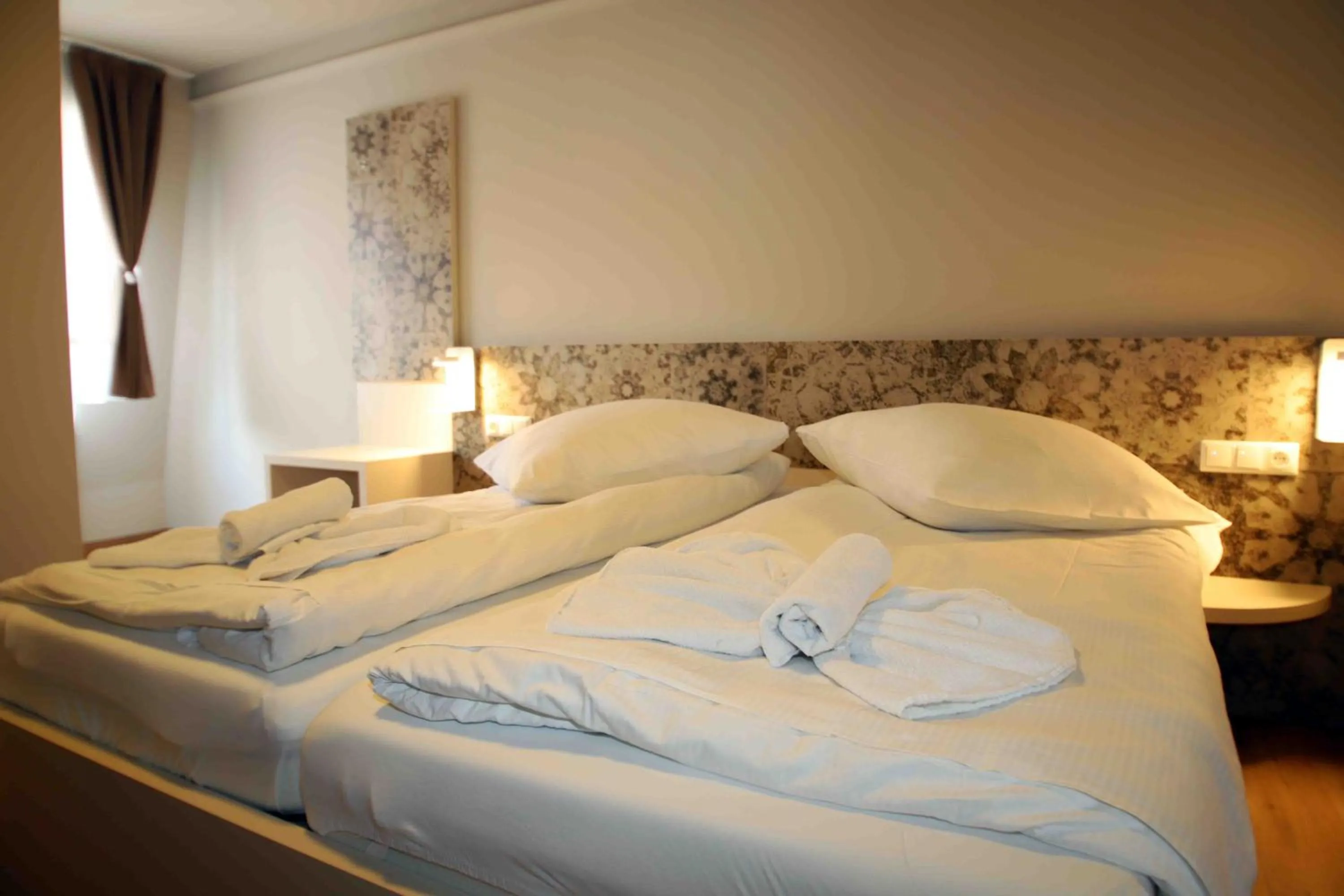 Bed in Pension Villa Colosseo im Herzen von Meiningen