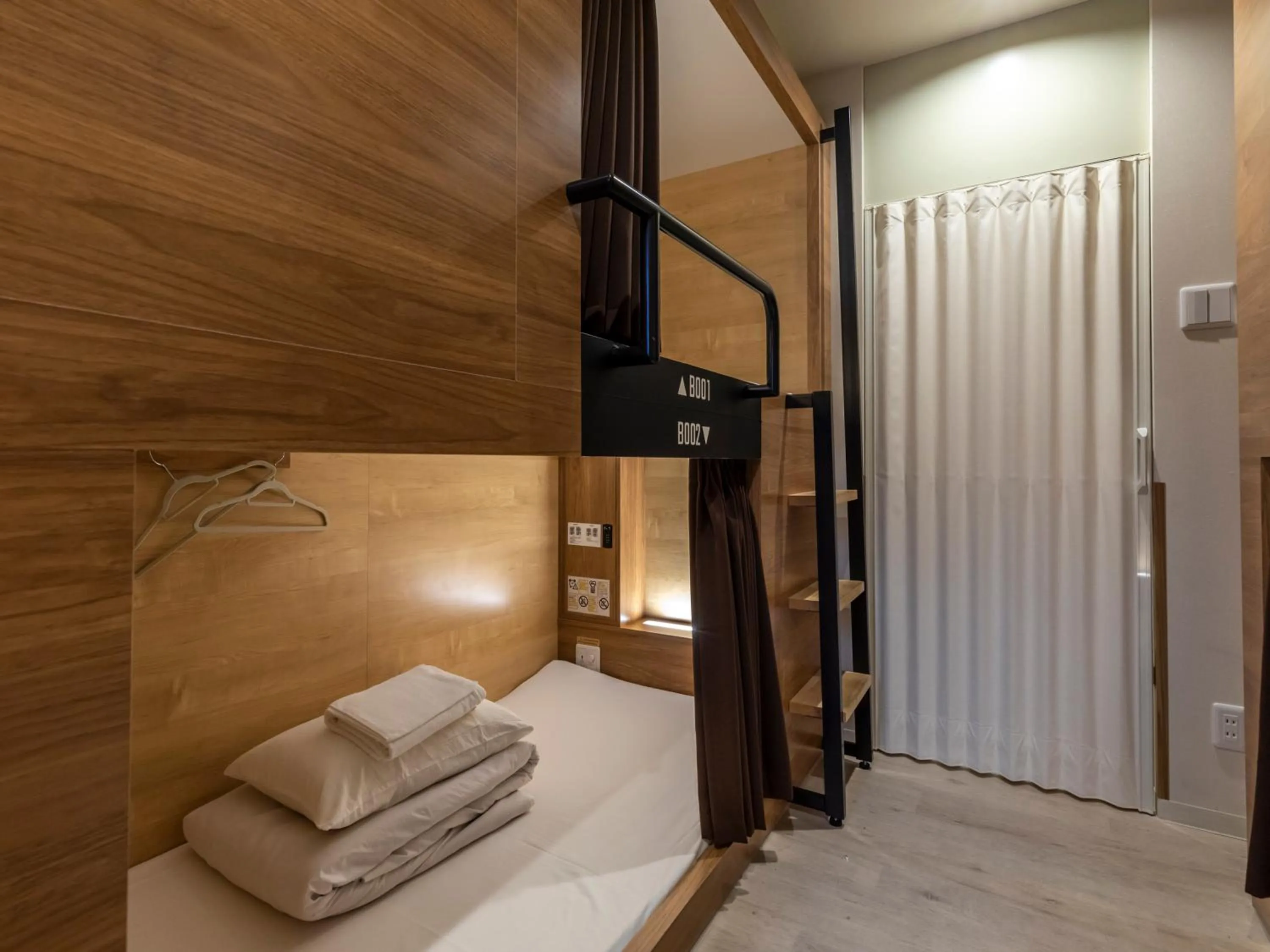 Bed in Tabist CapsuleHotel APODS Himeji Station