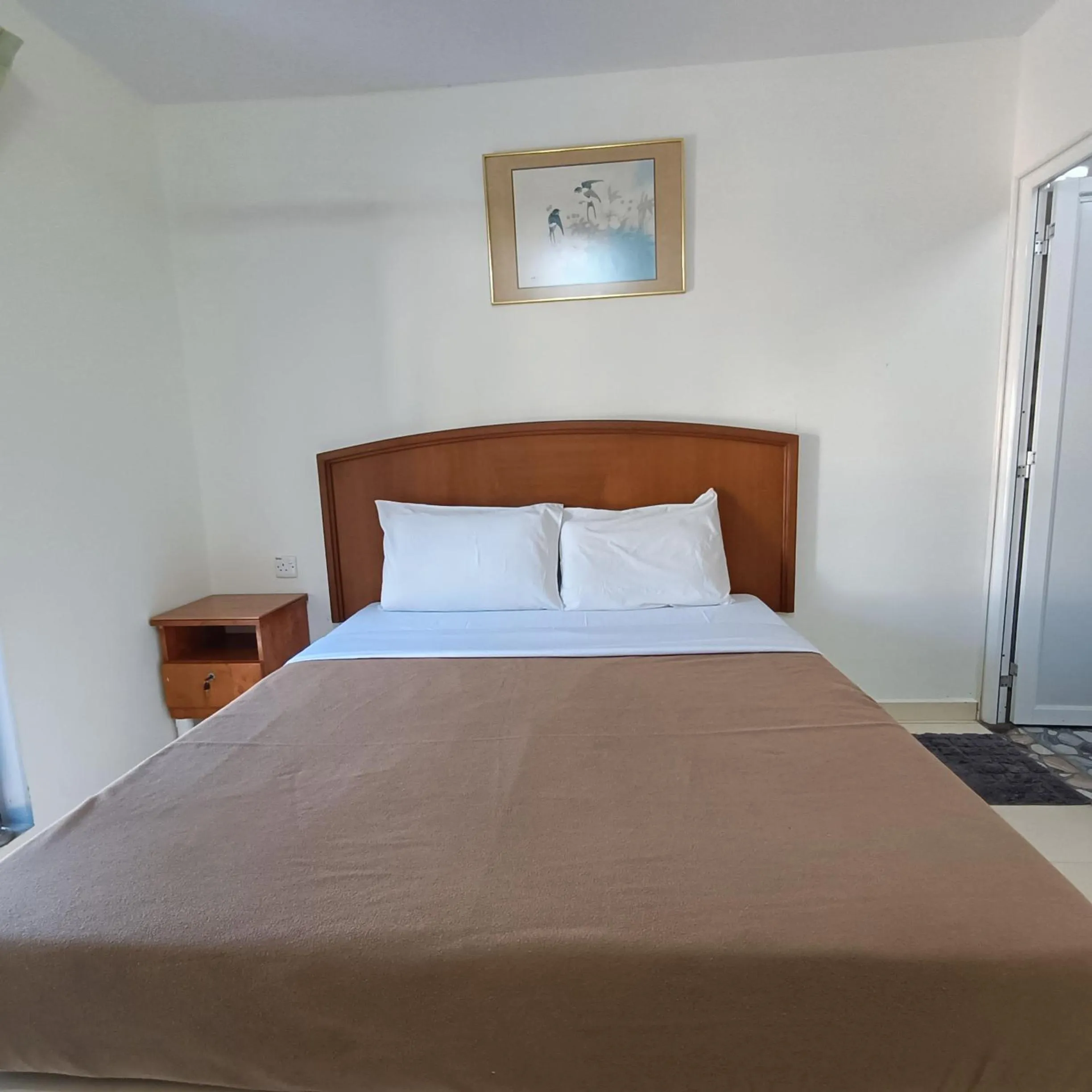 Bed in Kota Lodge Guest House