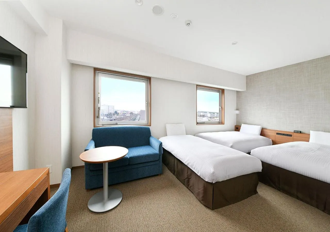 Living room, Bed in JR Inn Chitose