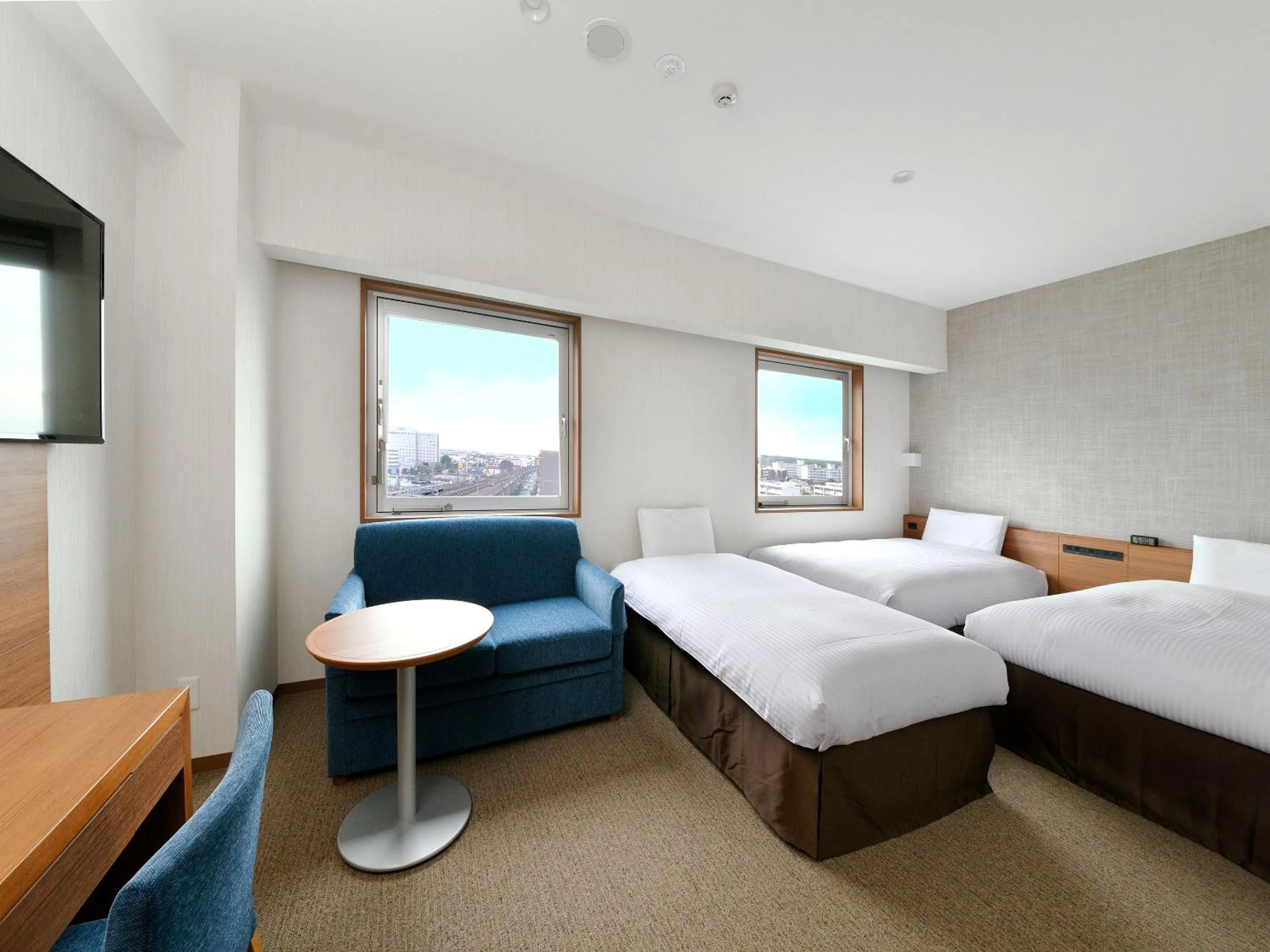 Living room, Bed in JR Inn Chitose