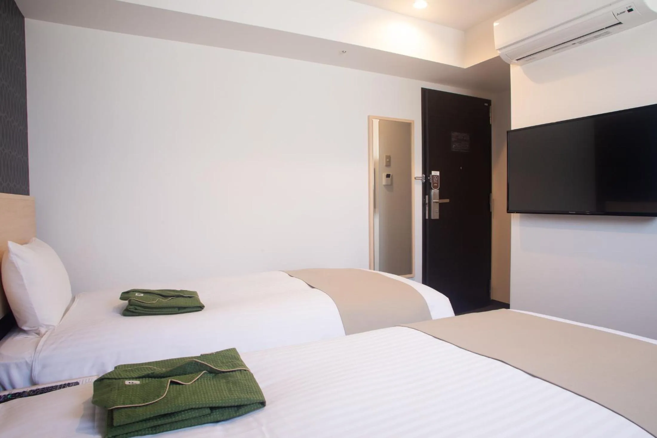 Bed in Hotel Kuretakeso Hiroshima Otemachi