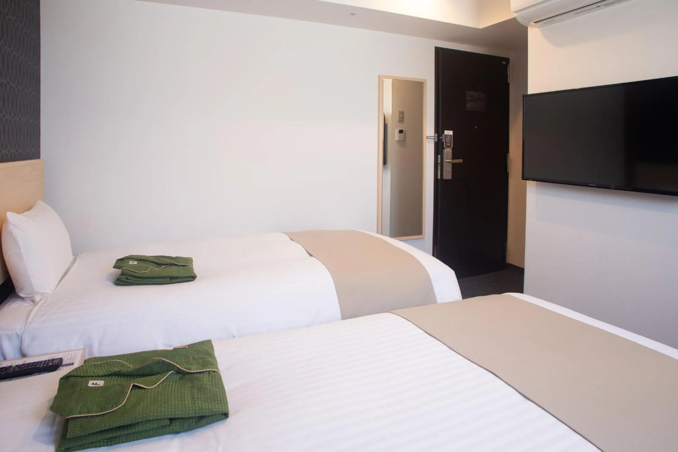 Bed in Hotel Kuretakeso Hiroshima Otemachi