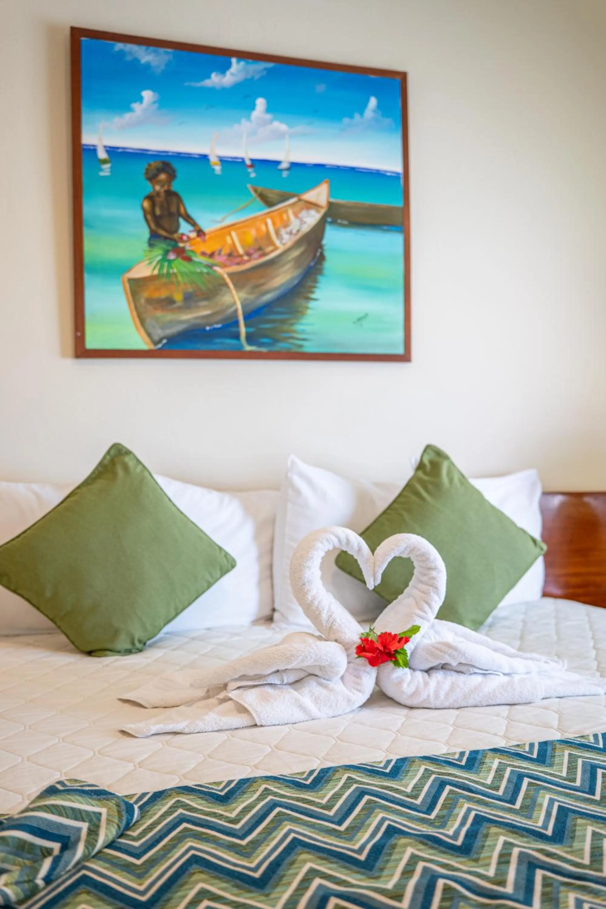 Bed in SunBreeze Suites