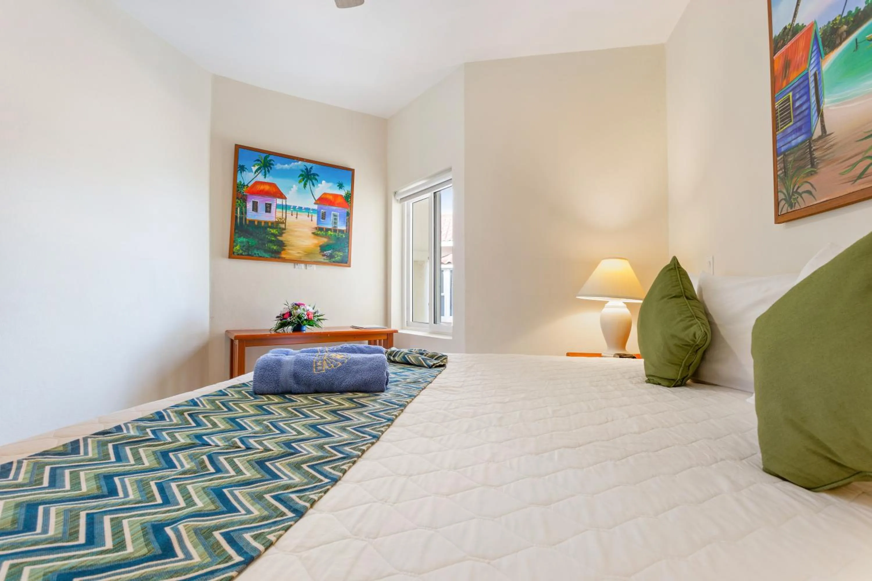 Bed in SunBreeze Suites