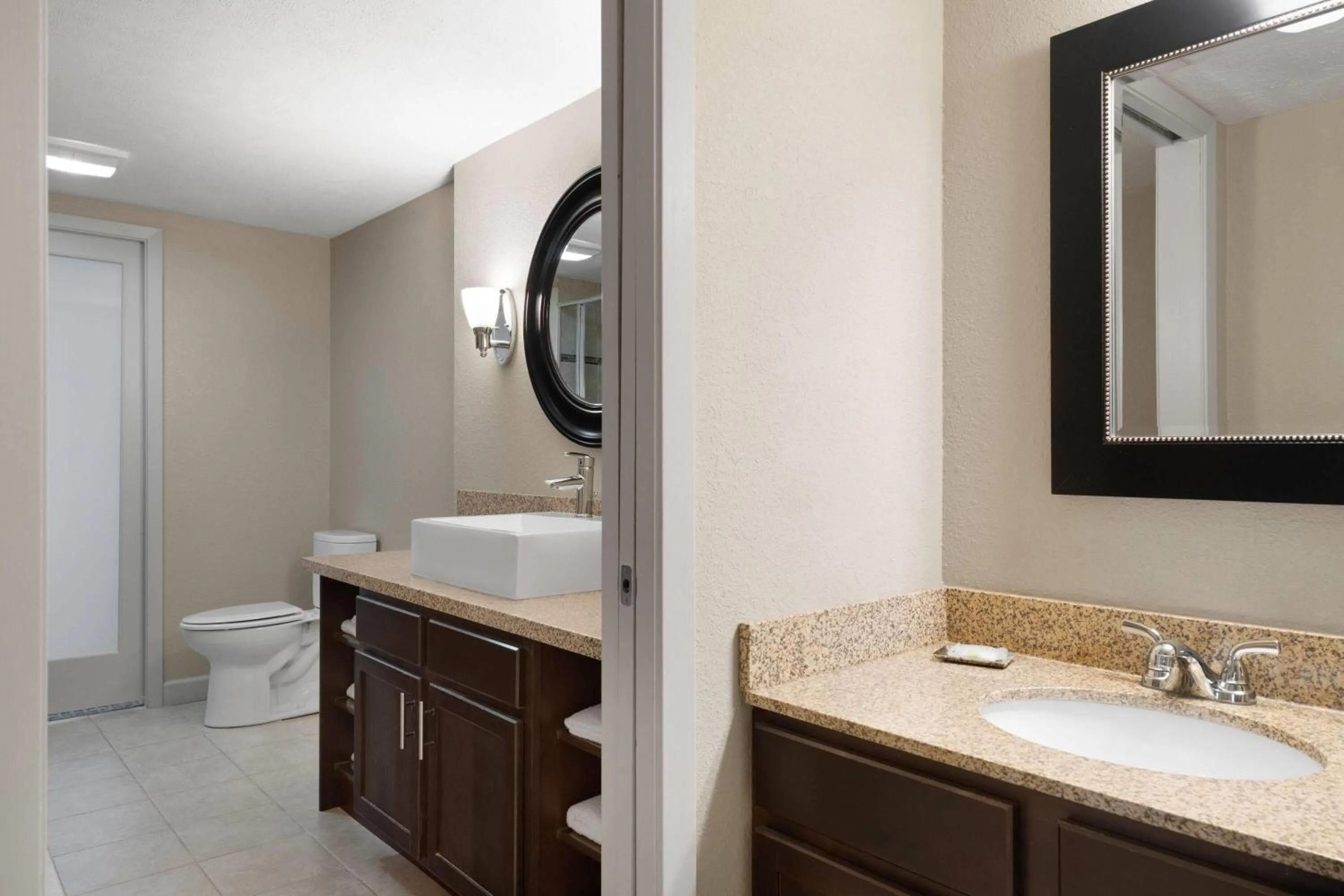 Bathroom in Eastland Suites Hotel & Conference Ctr, Trademark by Wyndham